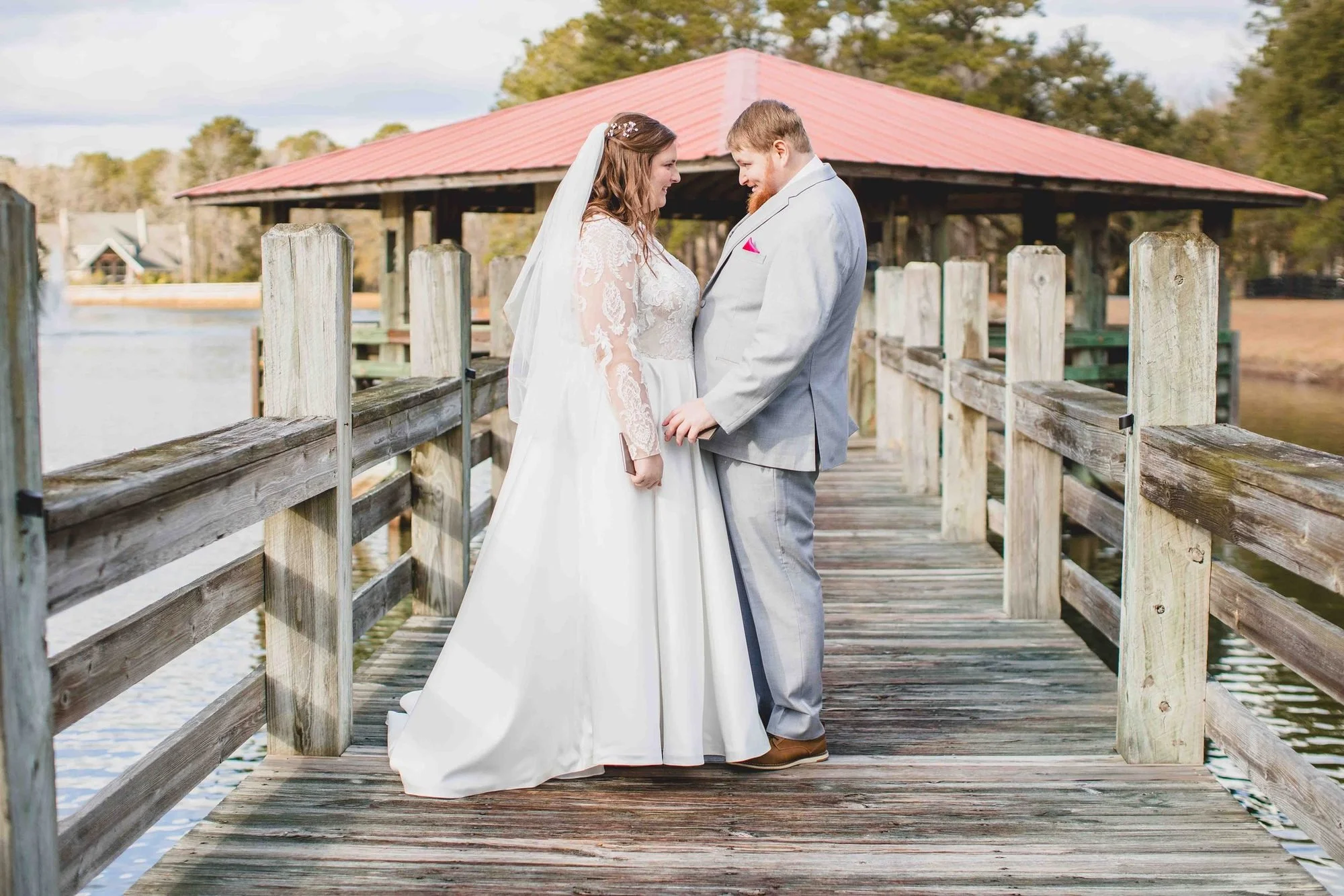 Winter wedding couple on the pier at Pepper Pavilion in Awendaw, SC