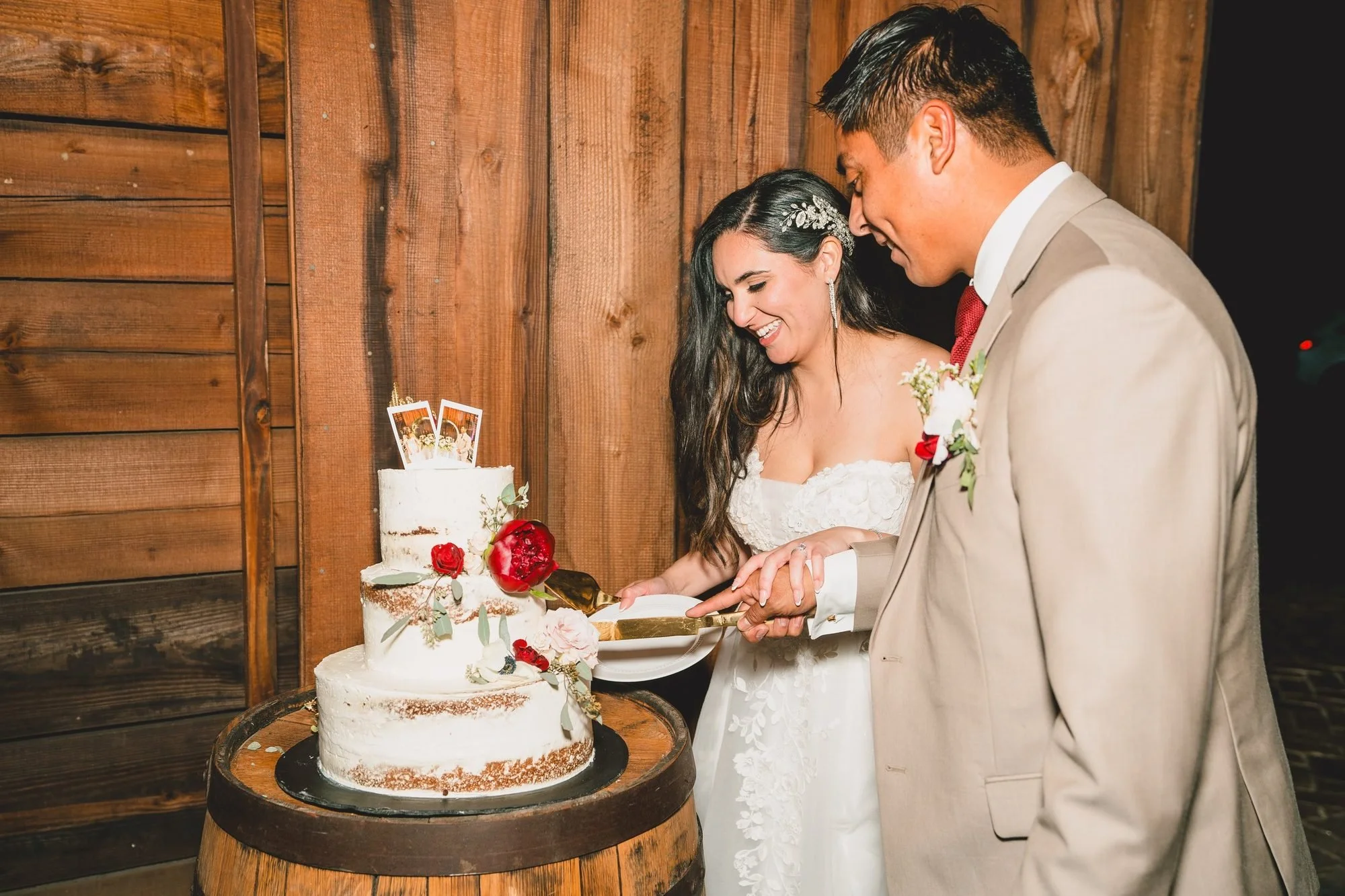 Cake cutting at a barn wedding reception in Ridgeland, SC