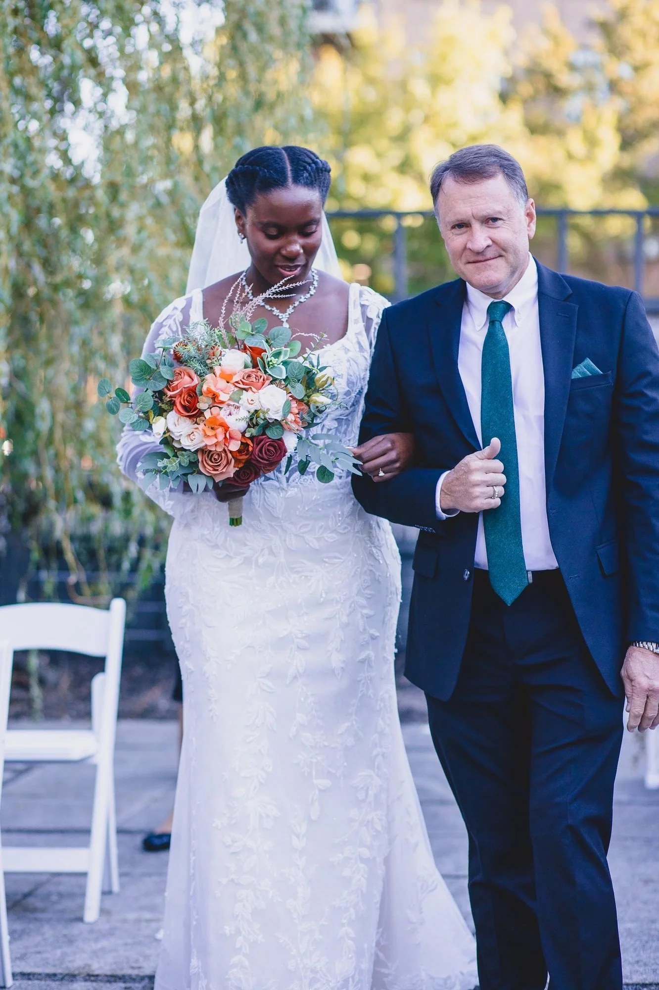 Bride walking down the aisle at a fall wedding
