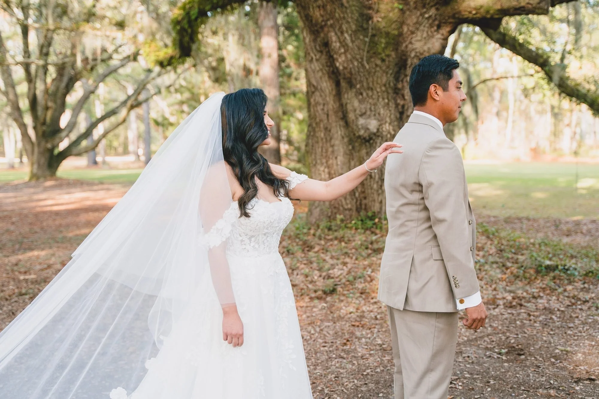 First look under the live oaks at a fall wedding in Ridgeland, SC
