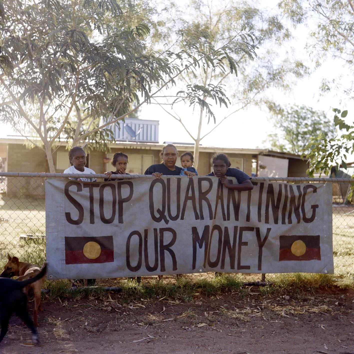 'Stop quarantining our money', Barb Shaw (Kaytetye, Arrernte, Warlpiri and Warumungu) and family, Mount Nancy Town Camp, Mparntwe/Alice Springs, NT, 2008. 