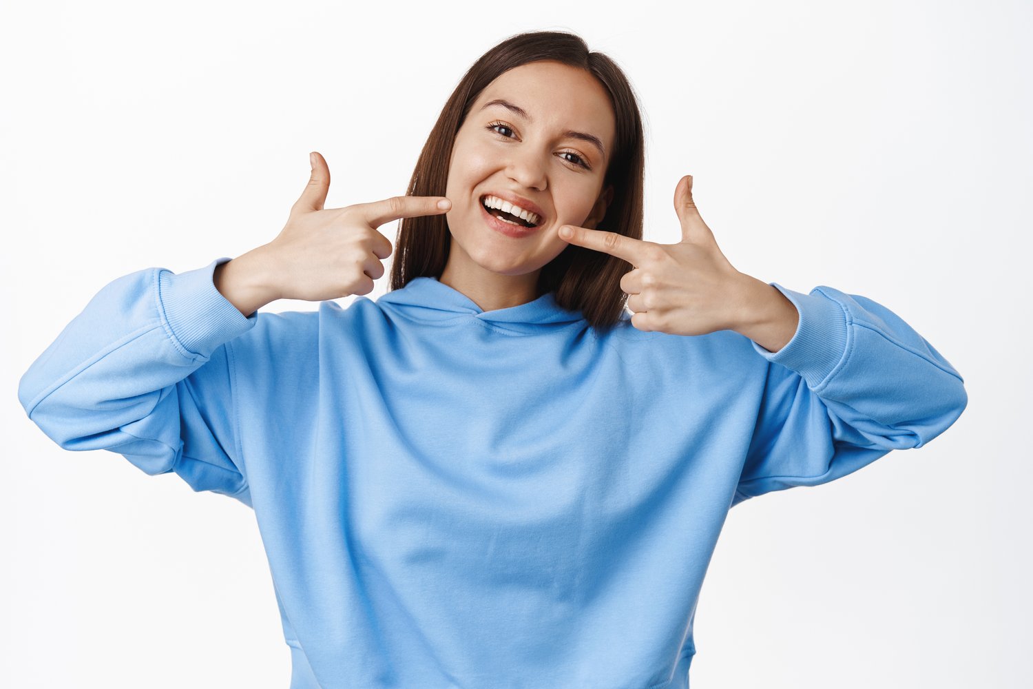 woman pointing to healthy teeth