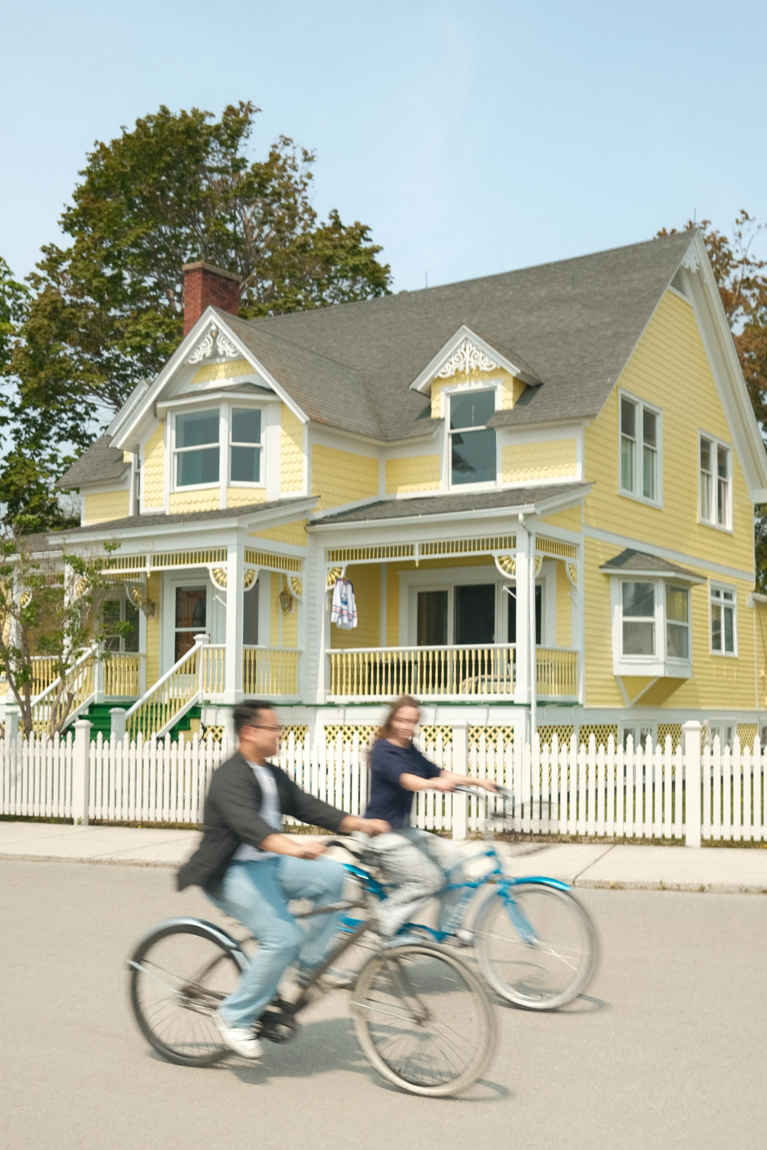 a blurry photo of owners Michael and Sarah riding bicycles
