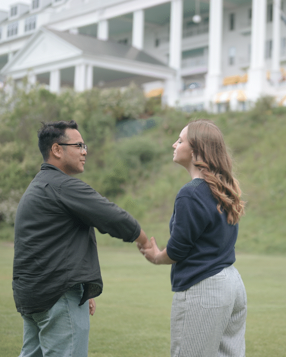 owners michael and sarah spinning in front of The Grand Hotel on Mackinac Island