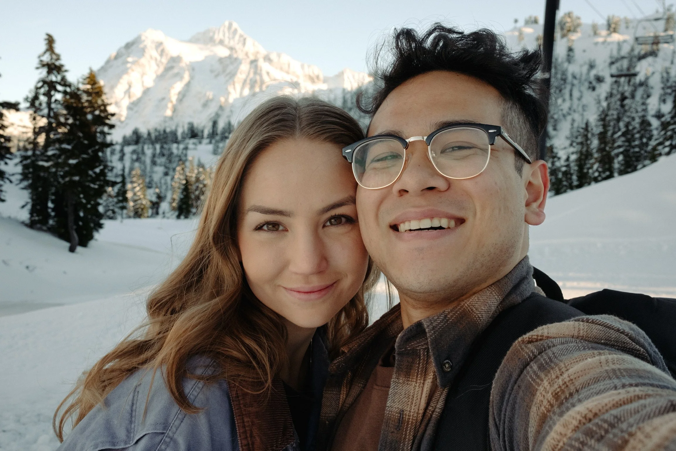 owners Michael and Sarah in front of Mount Baker from the Artist Point lookout