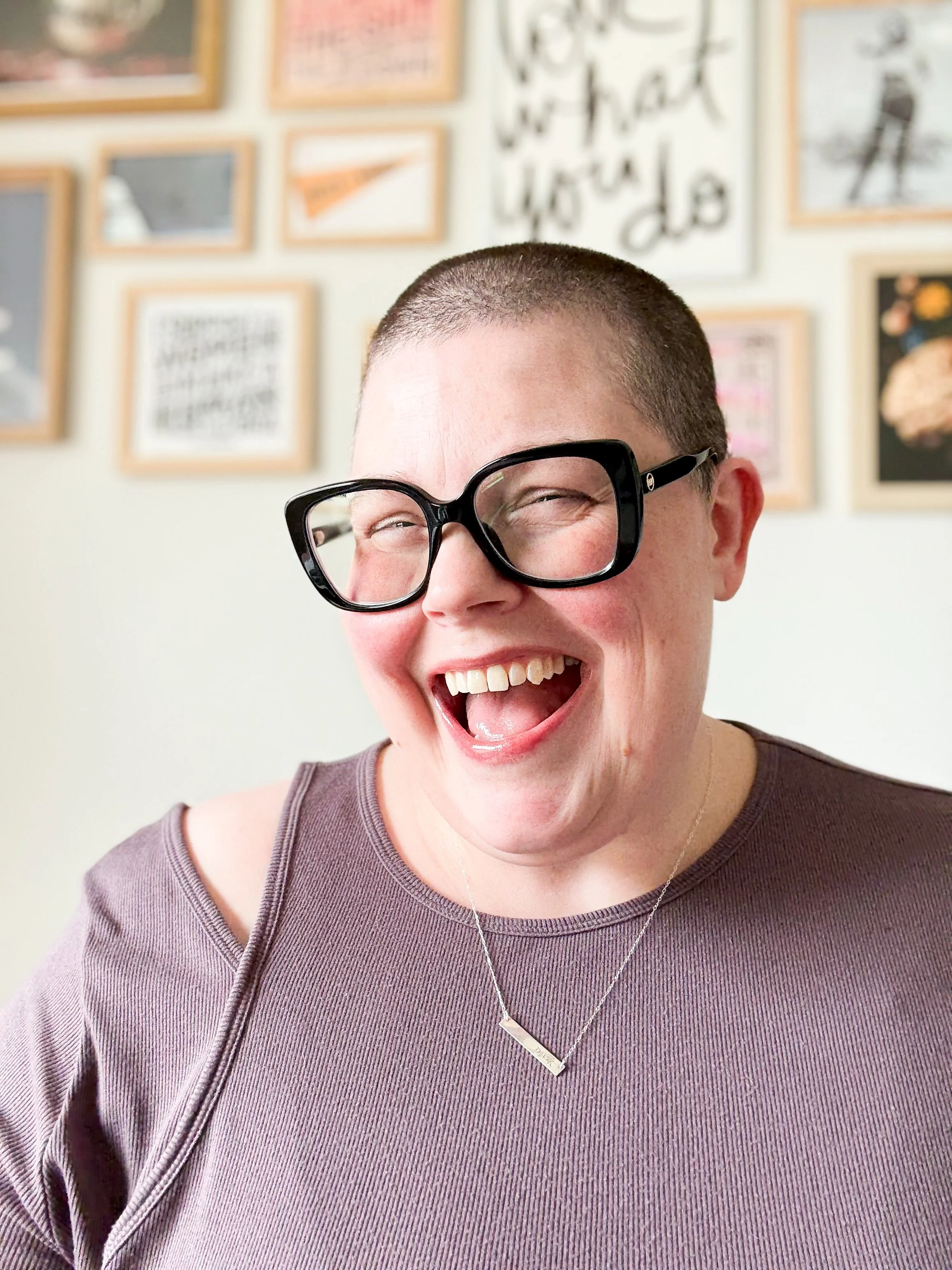 Smiling portrait of the Karen Hammons Co. founder wearing oversized black glasses.