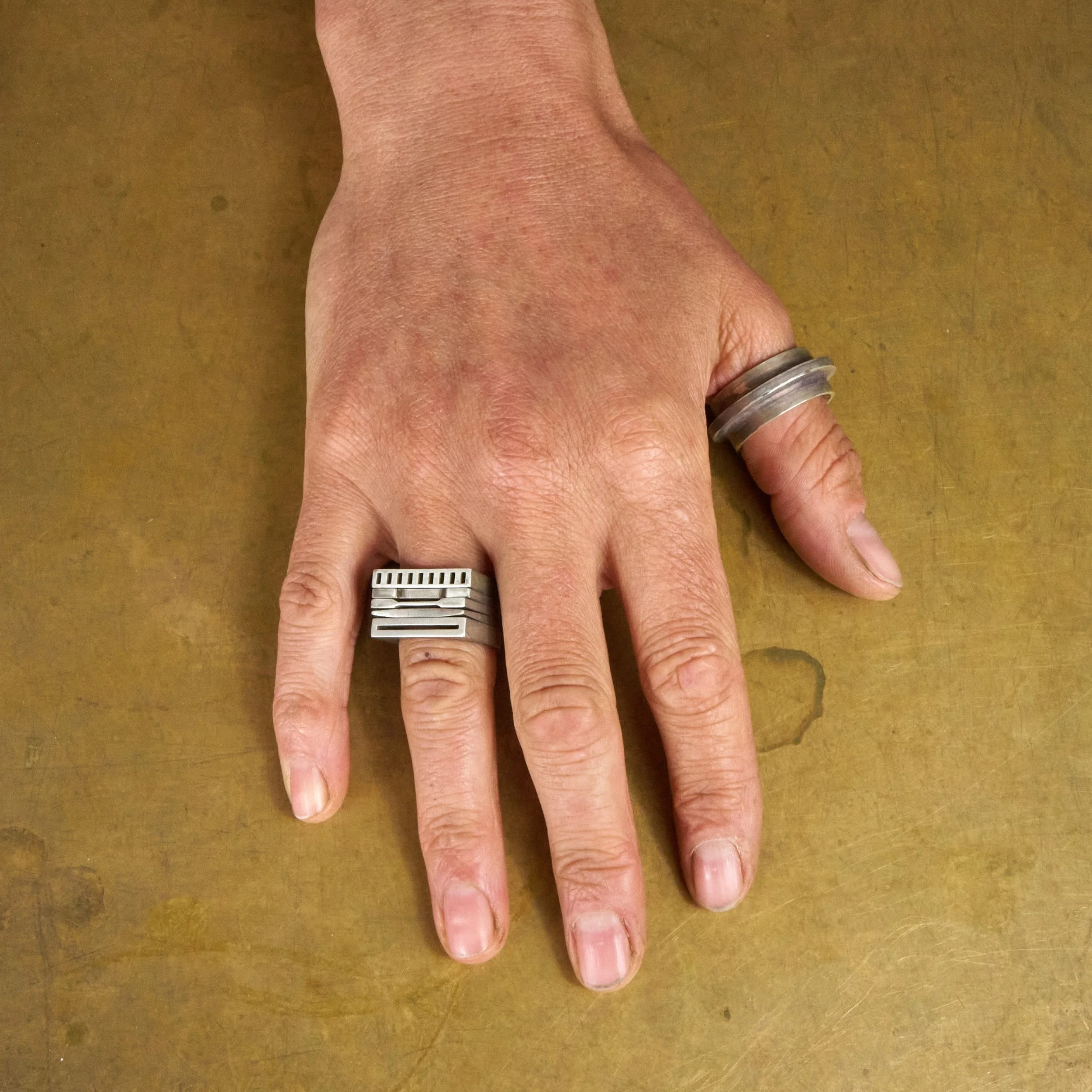 Hand on Brass Table.jpg