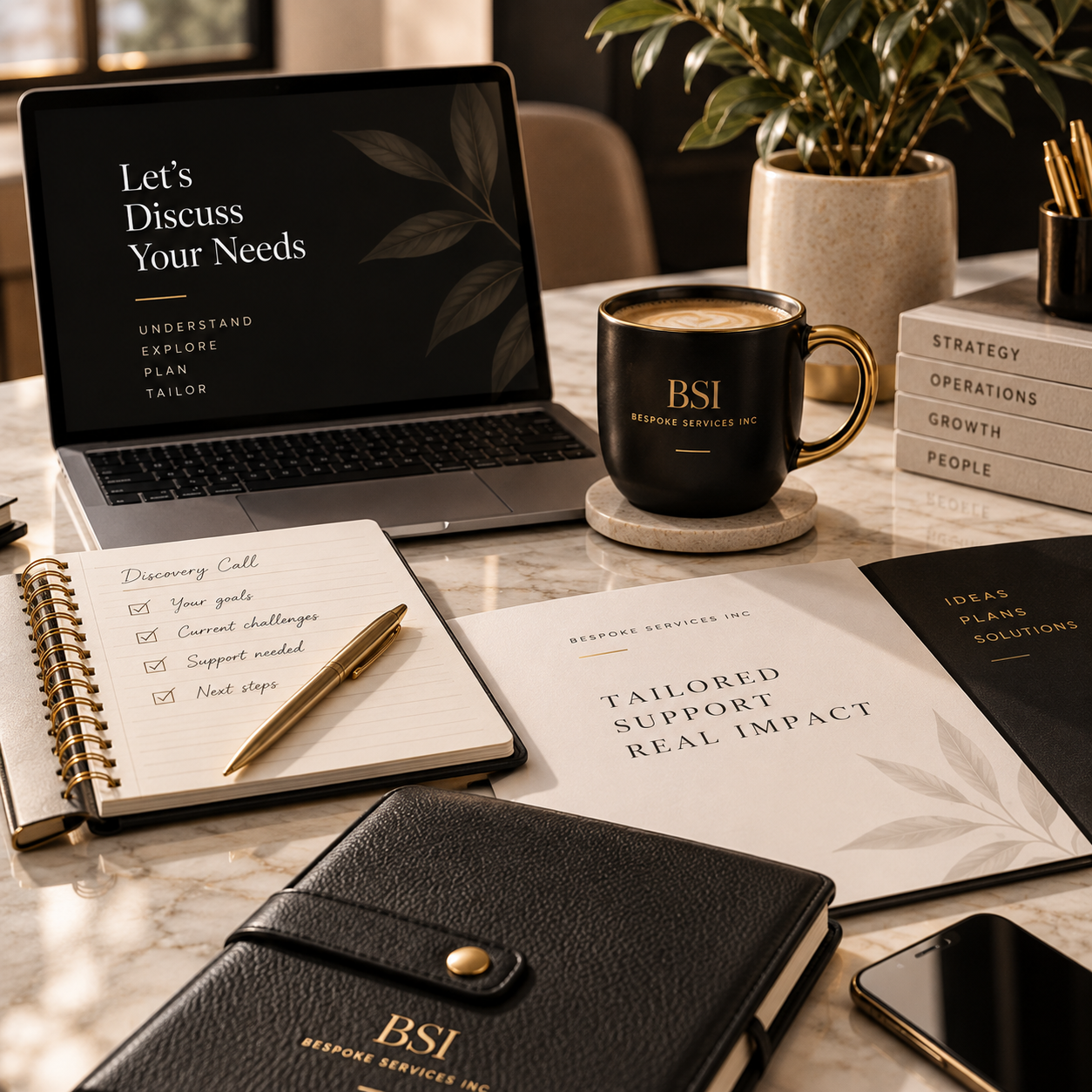 A workspace with a laptop displaying the message "Let's Discuss Your Needs," a black mug with gold accents labeled "BSI Bespoke Services Inc," a notebook with a gold pen, a brochure that says "Tailored Support Real Impact," a potted plant, several stacked books labeled with business terms, a black leather notebook, and a framed menu of services including ideas, plans, and solutions.