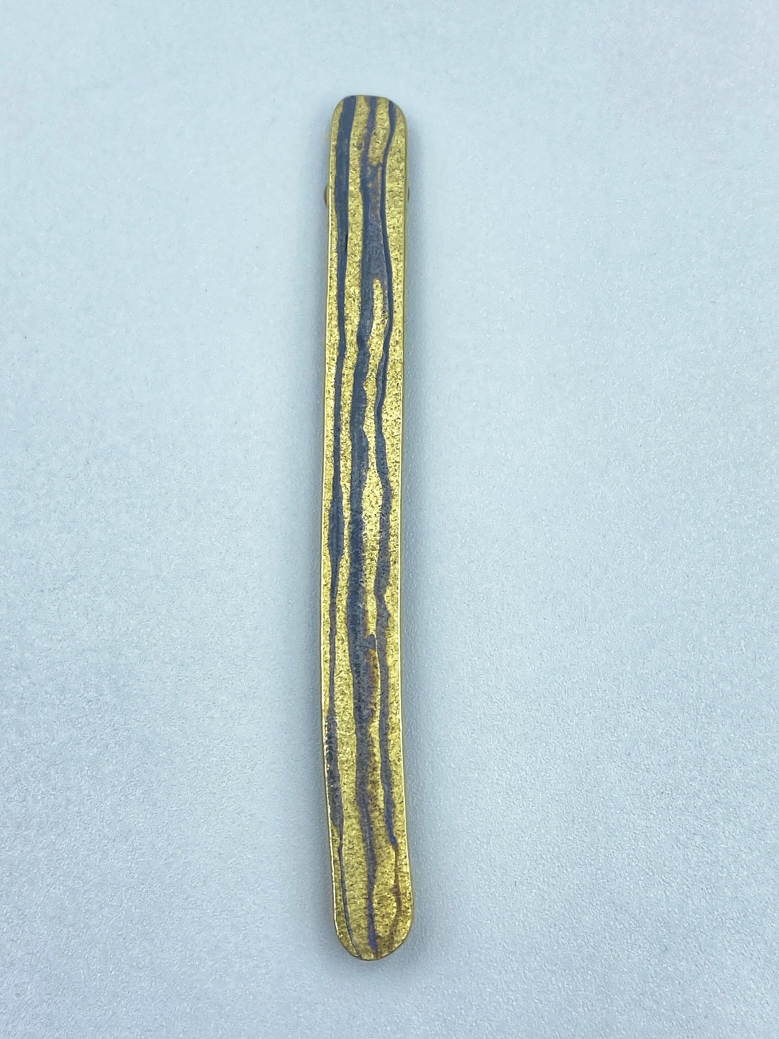 Golden Repair brooch