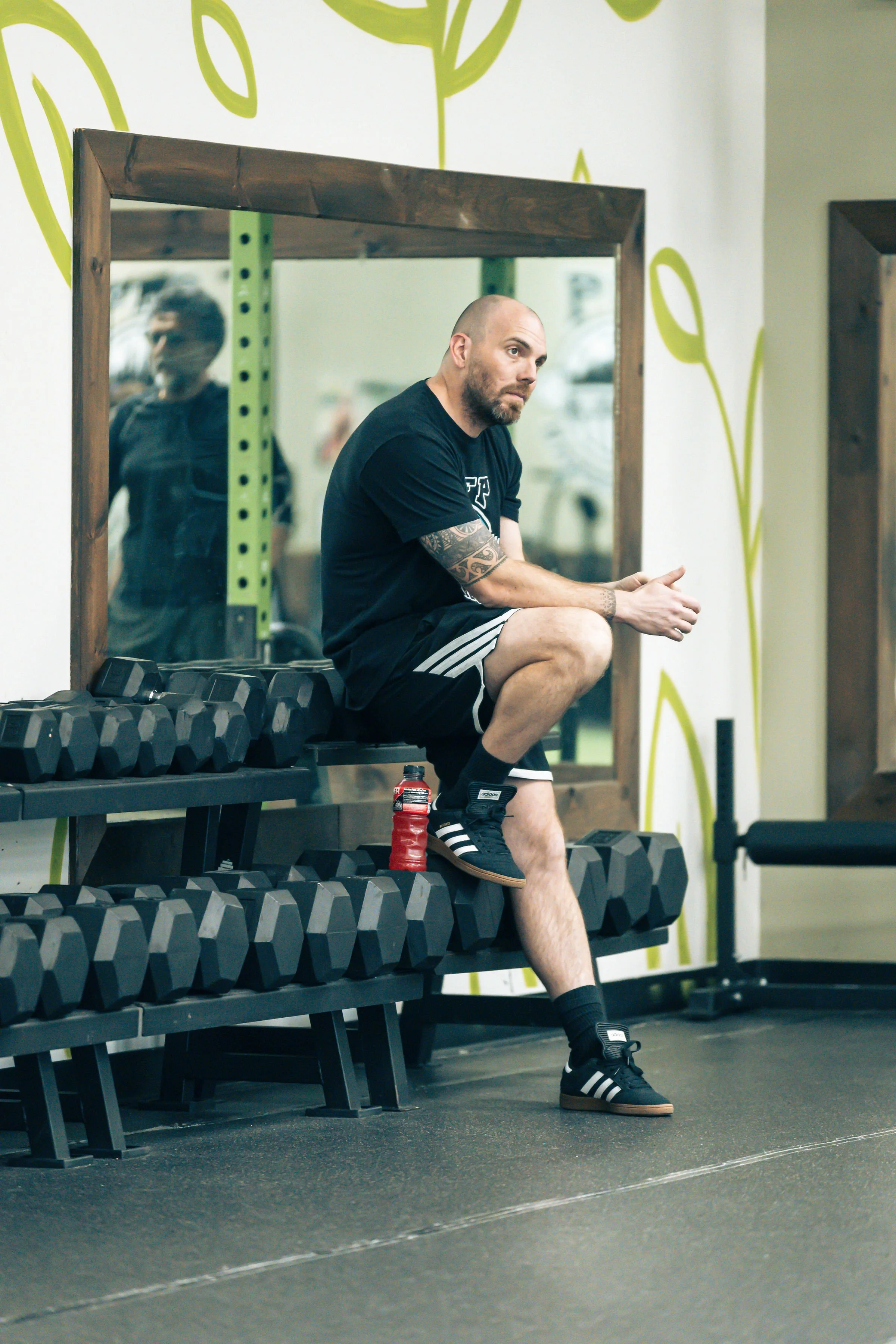 Image of Co-Owner and Coach Wes talking to and coaching a PFP client.