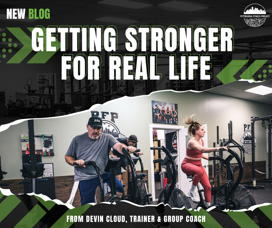 BLOG GRAPHIC: GETTING STRONGER FOR REAL LIFE. Image of PFP Method class using the air bikes.