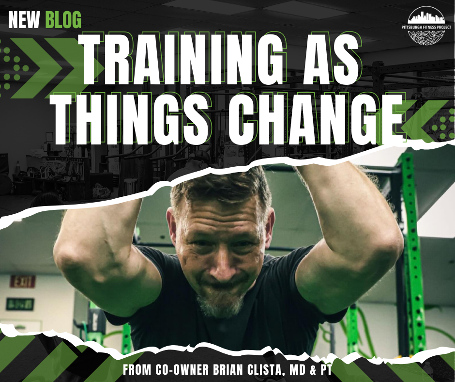 BLOG GRAPHIC: TRAINING AS THINGS CHANGE. Image of co-owner Brian working out with TRX bands.