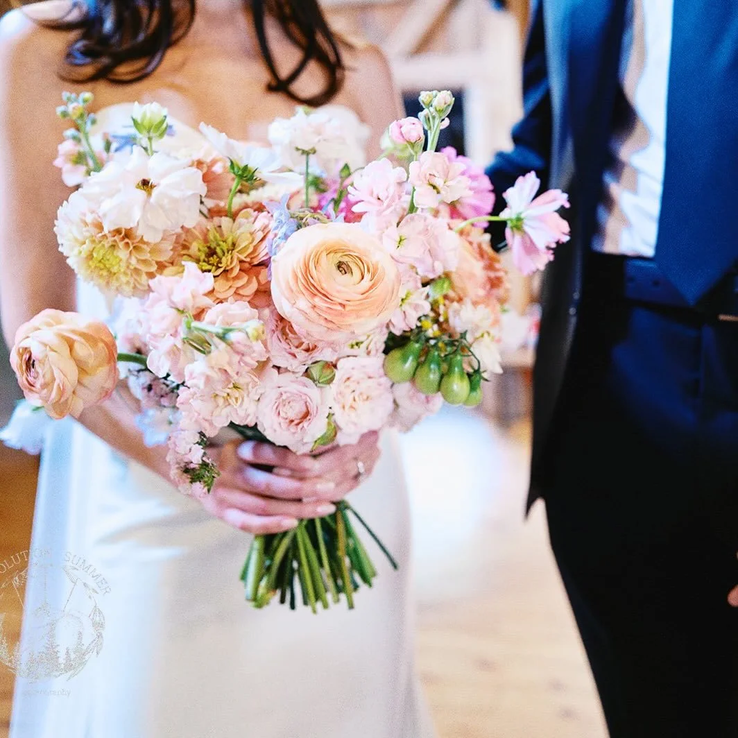 For Erin &amp; Matthew&rsquo;s August wedding, the inspiration was a dreamy, pastel garden party. 

I wove in cheerful zinnias, airy cosmos, and lush dahlias grown right here on our farm, and for that perfect mid-August touch - a little sprig of gree