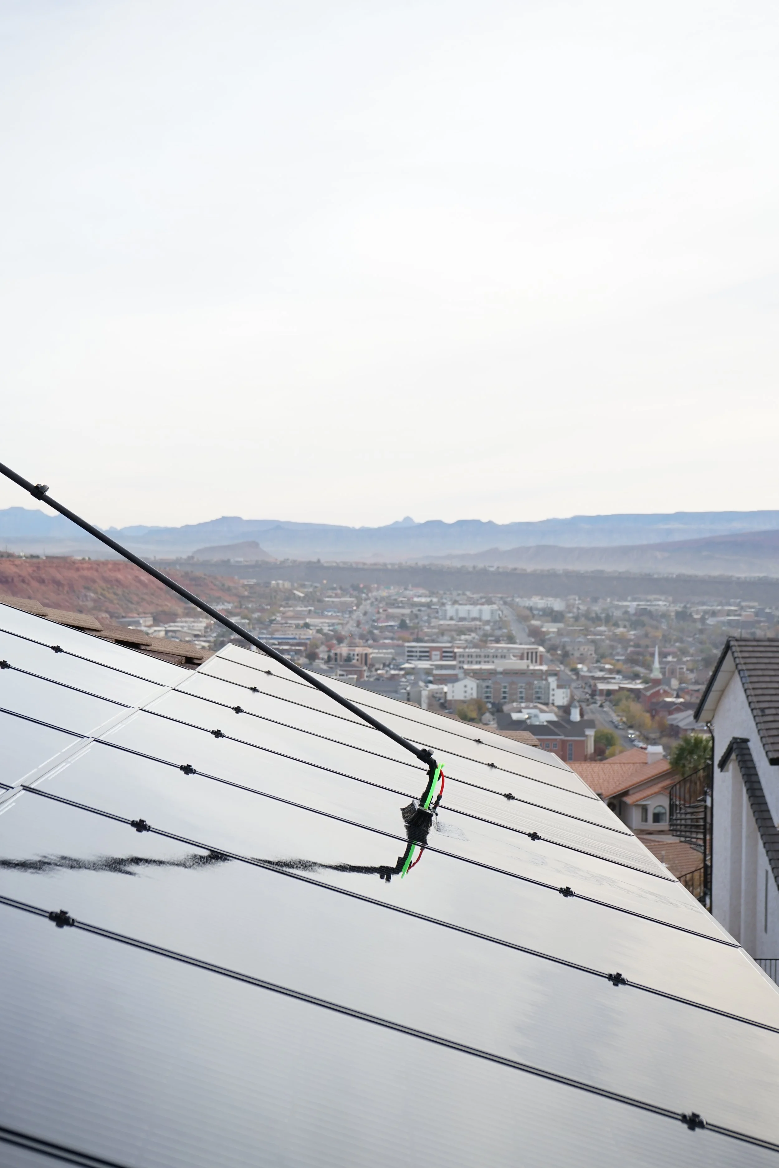 Rinsing off the solar panels with a beautiful view of St. George Utah.