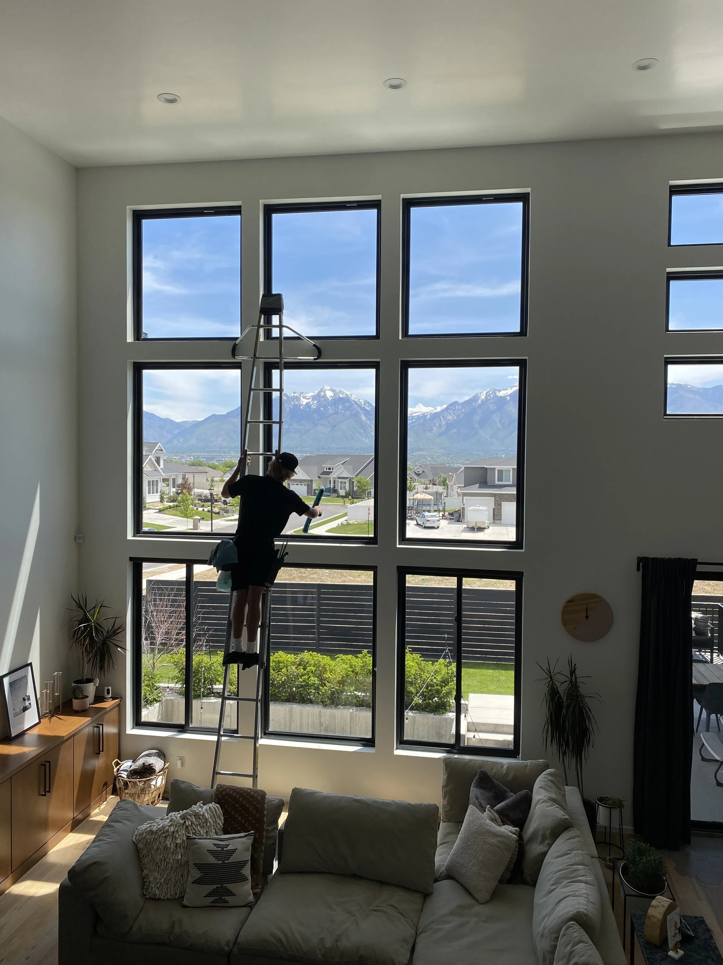 3SIXTY cleaning windows in Brigham City, with a stunning Utah background. Experience our professional services in beautiful Northern Utah.