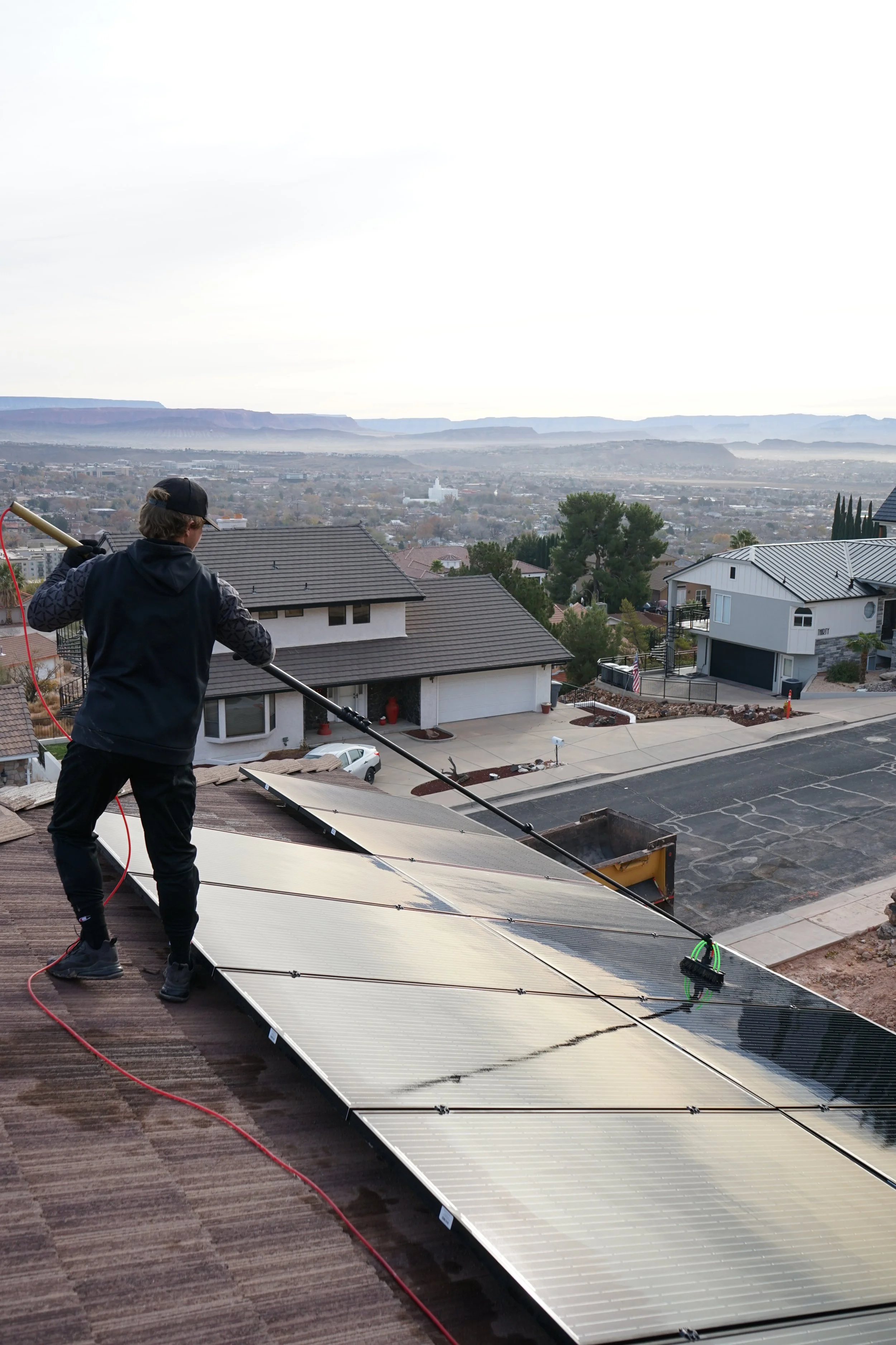 3Sixty Window Washing professionally cleaning solar panels, ensuring optimal performance and efficiency.