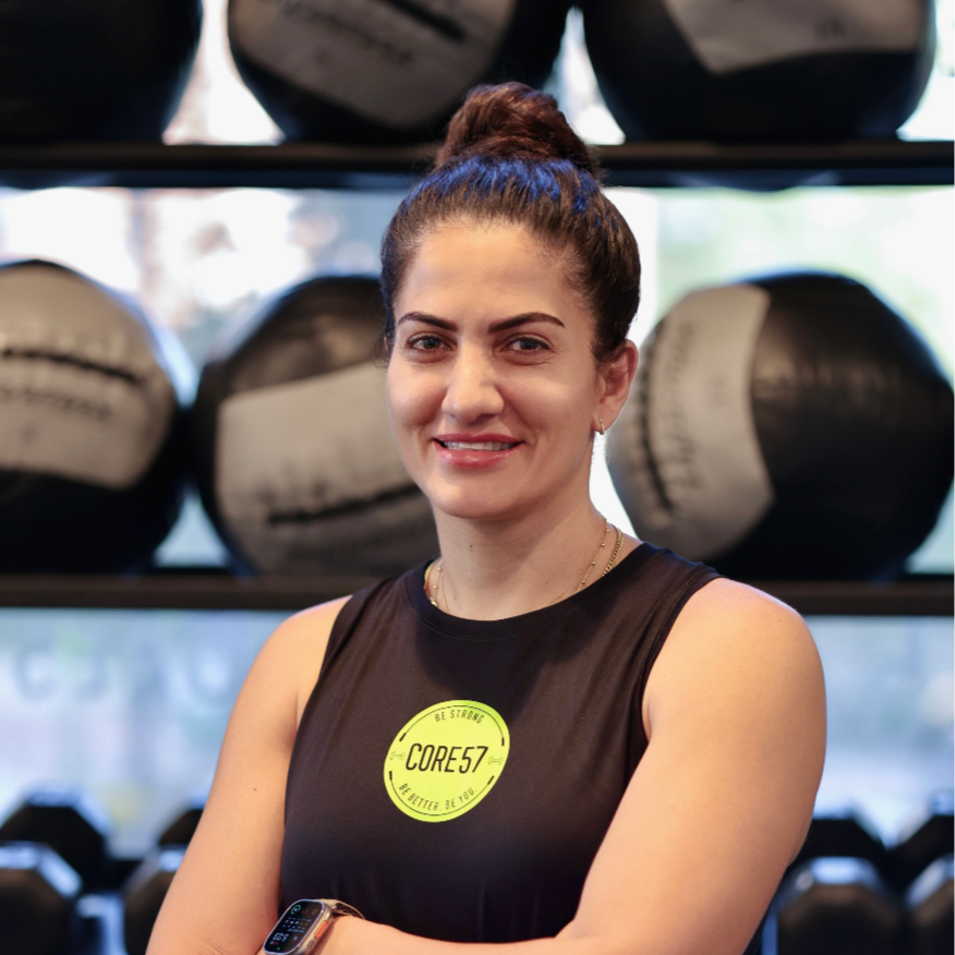 Headshot of Rawan Abu-Jerise, the newest personal trainer at CORE57 in Alpharetta, GA