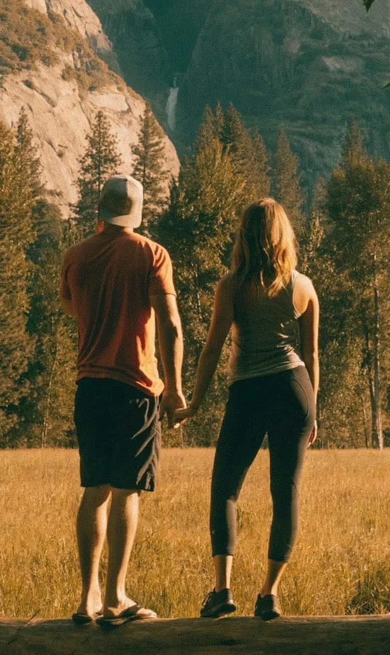 couple holding hands in the wild
