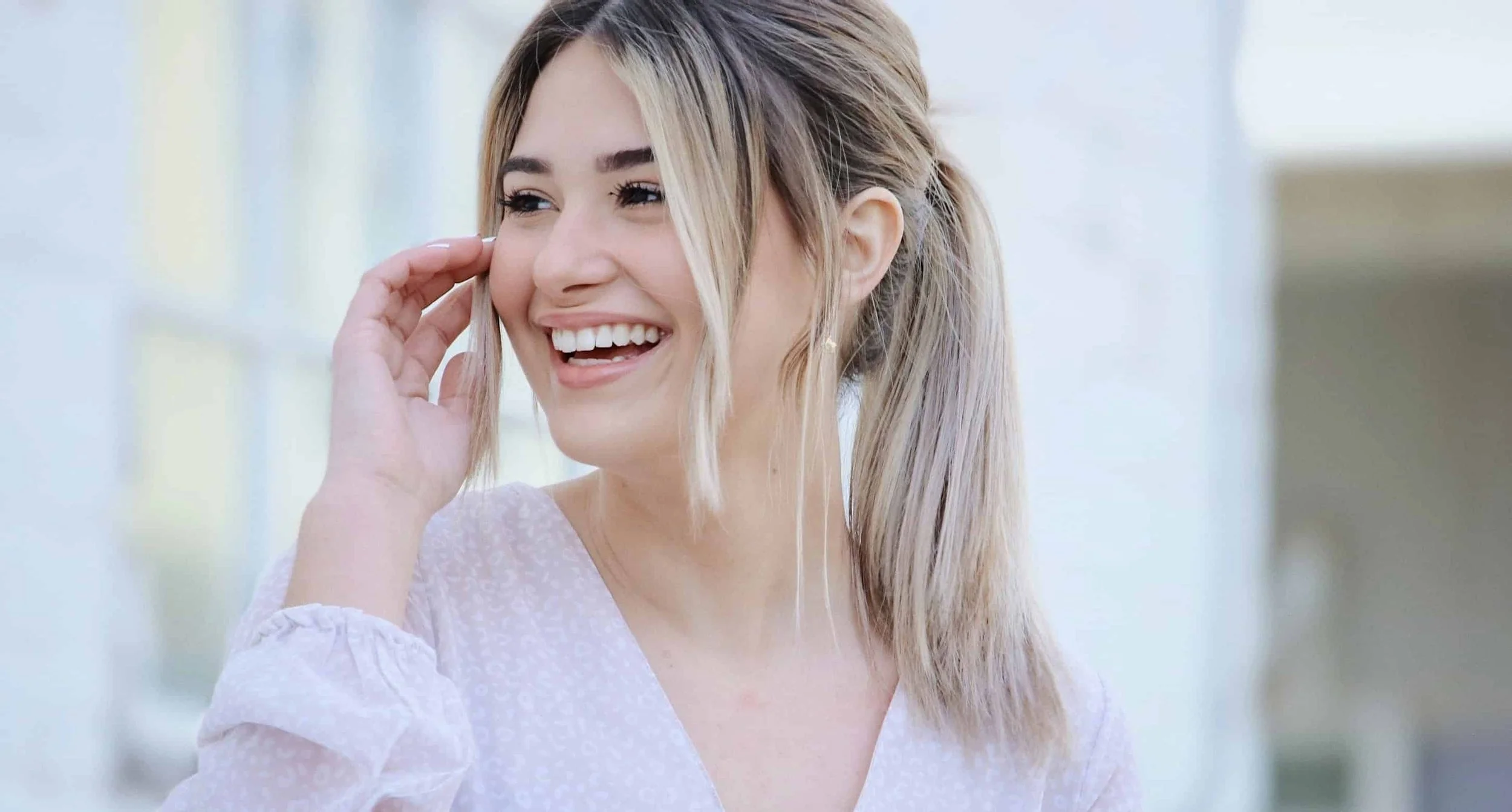 woman smiling while looking away