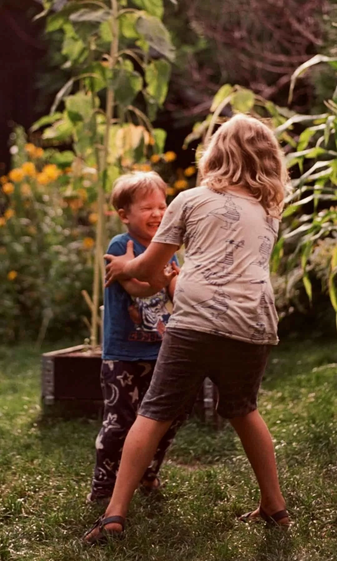 kids playing outside in backyard