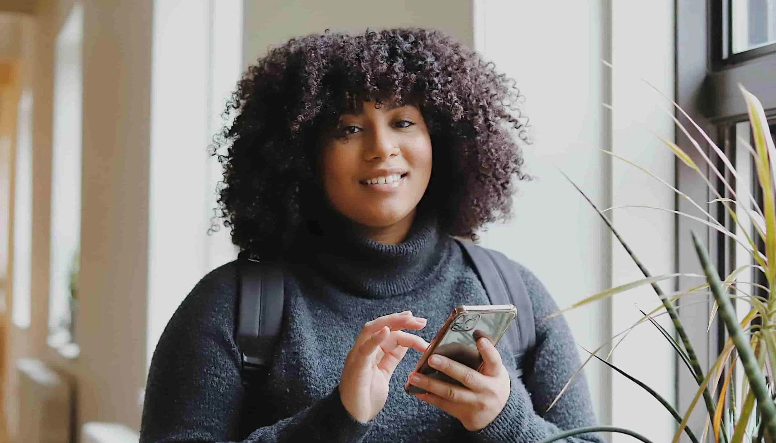 woman typing on phone