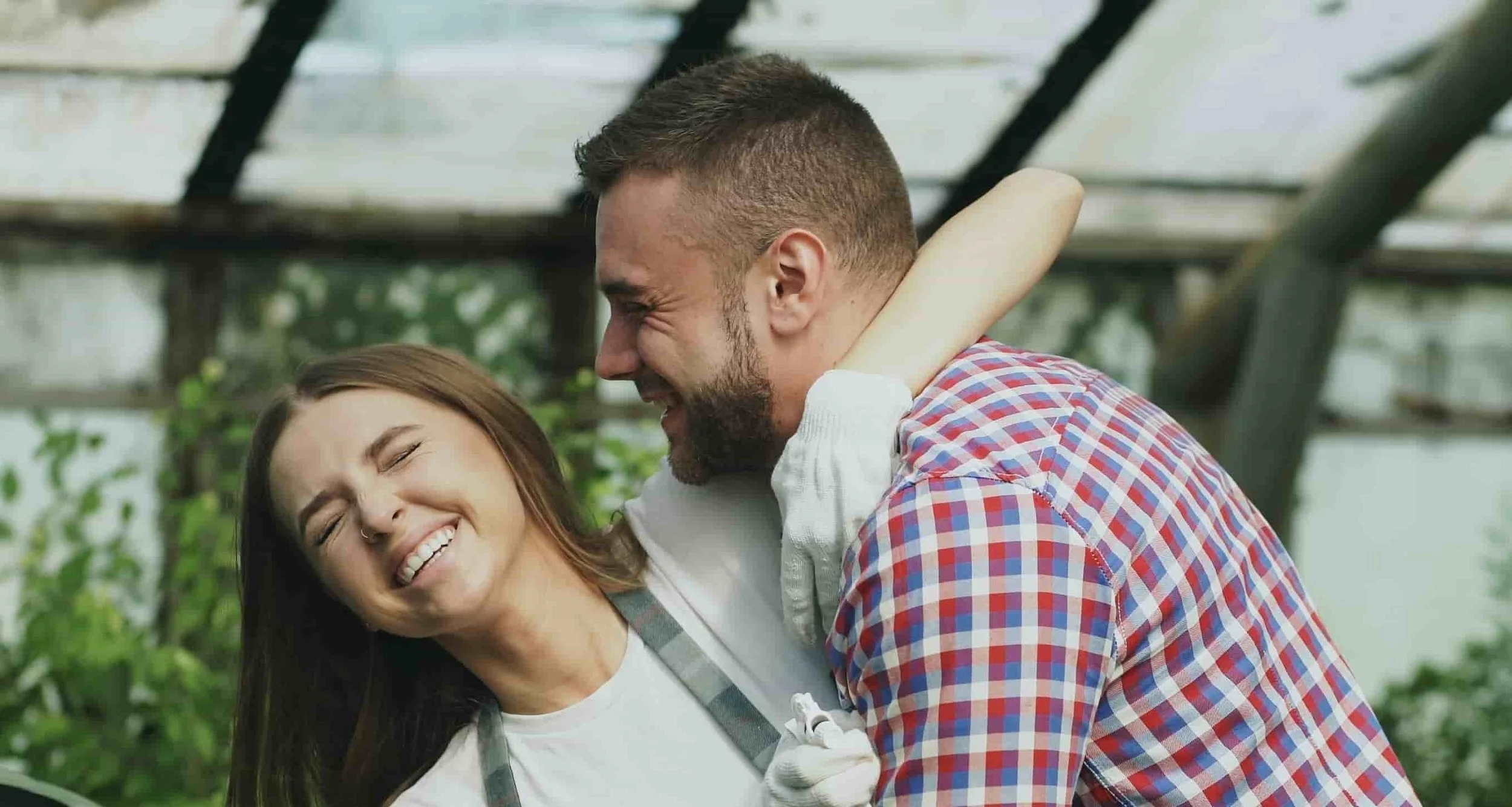 couple hugging while laughing