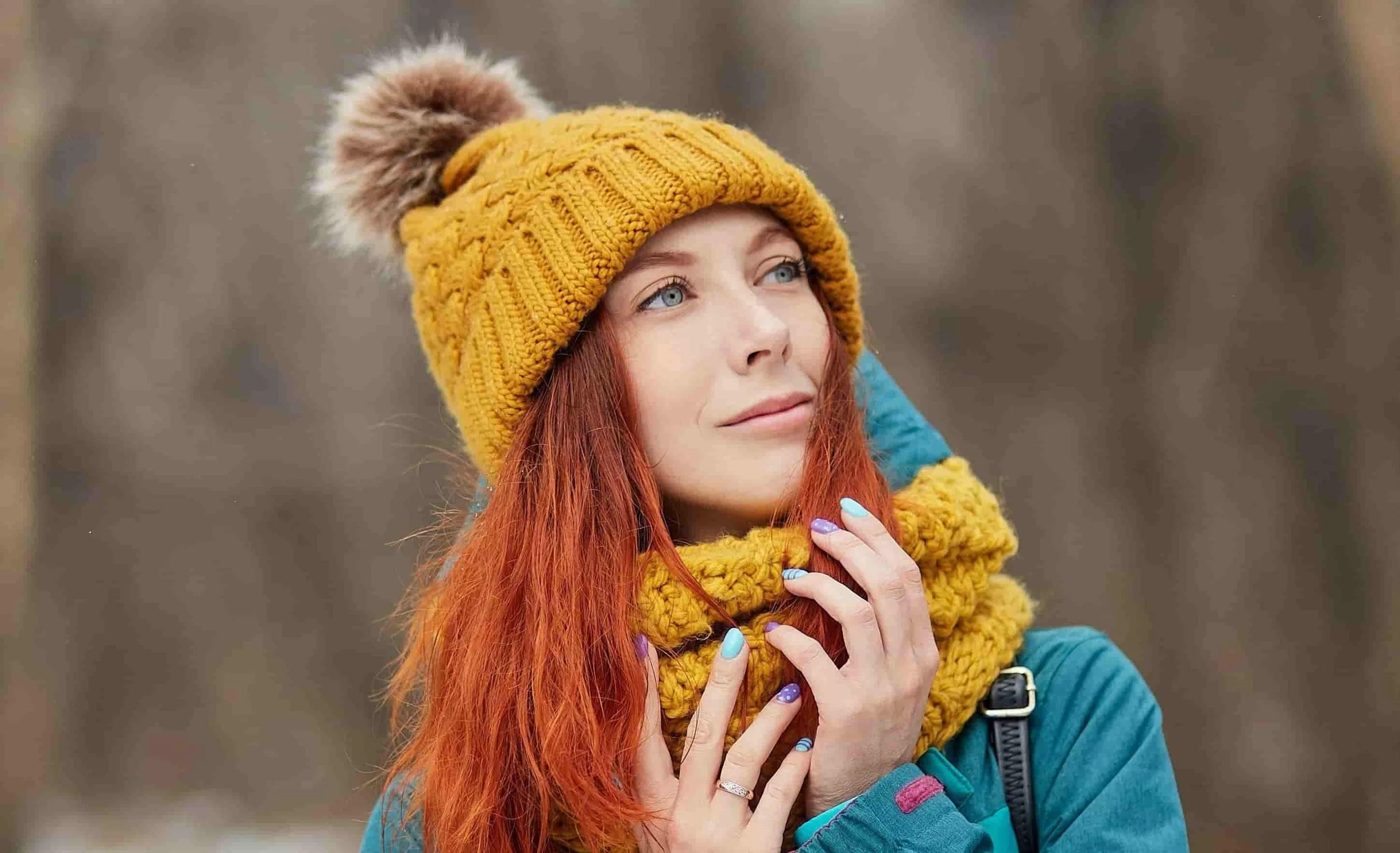 woman outside in a forest during the winter time