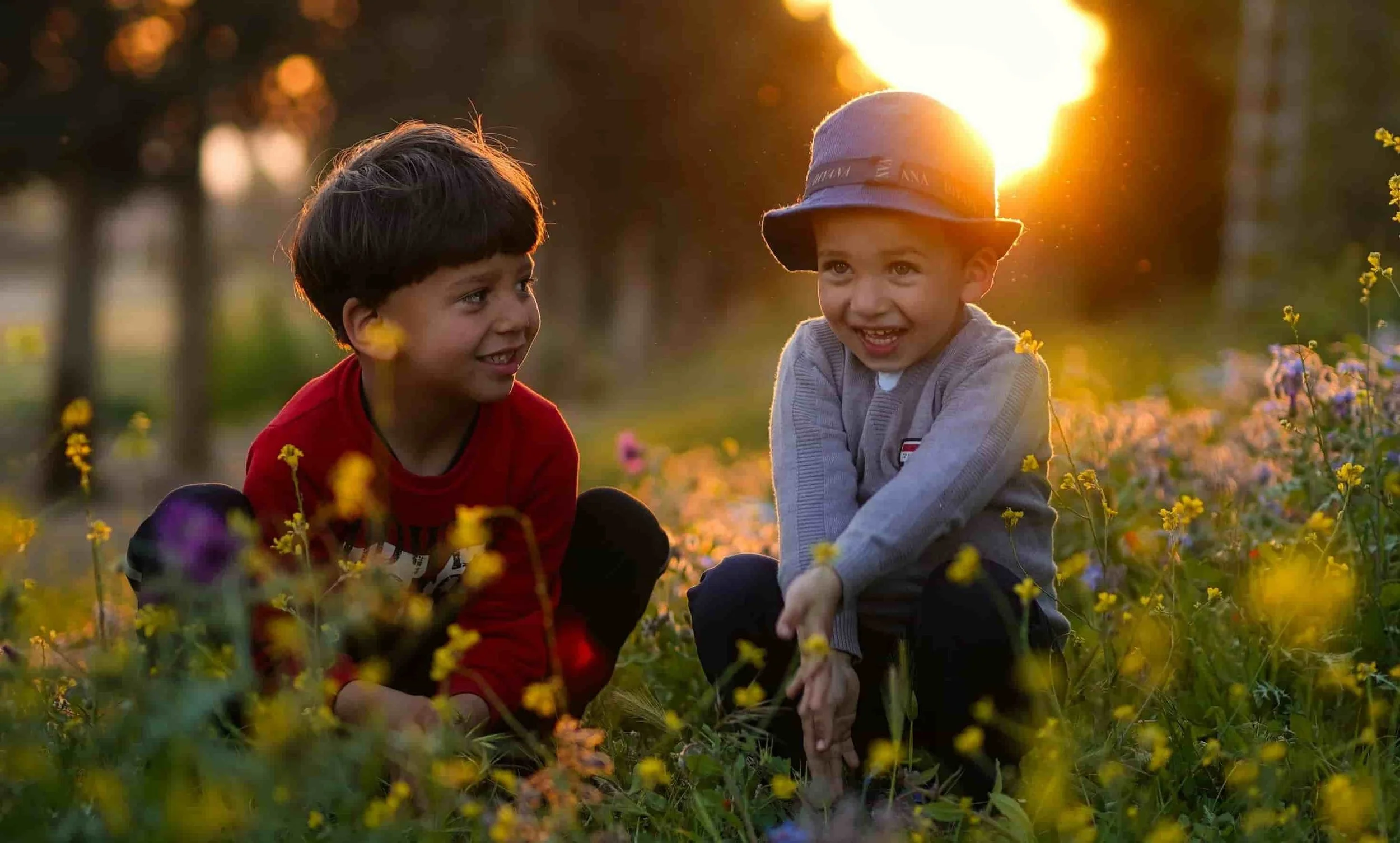 two little boys playing in the field