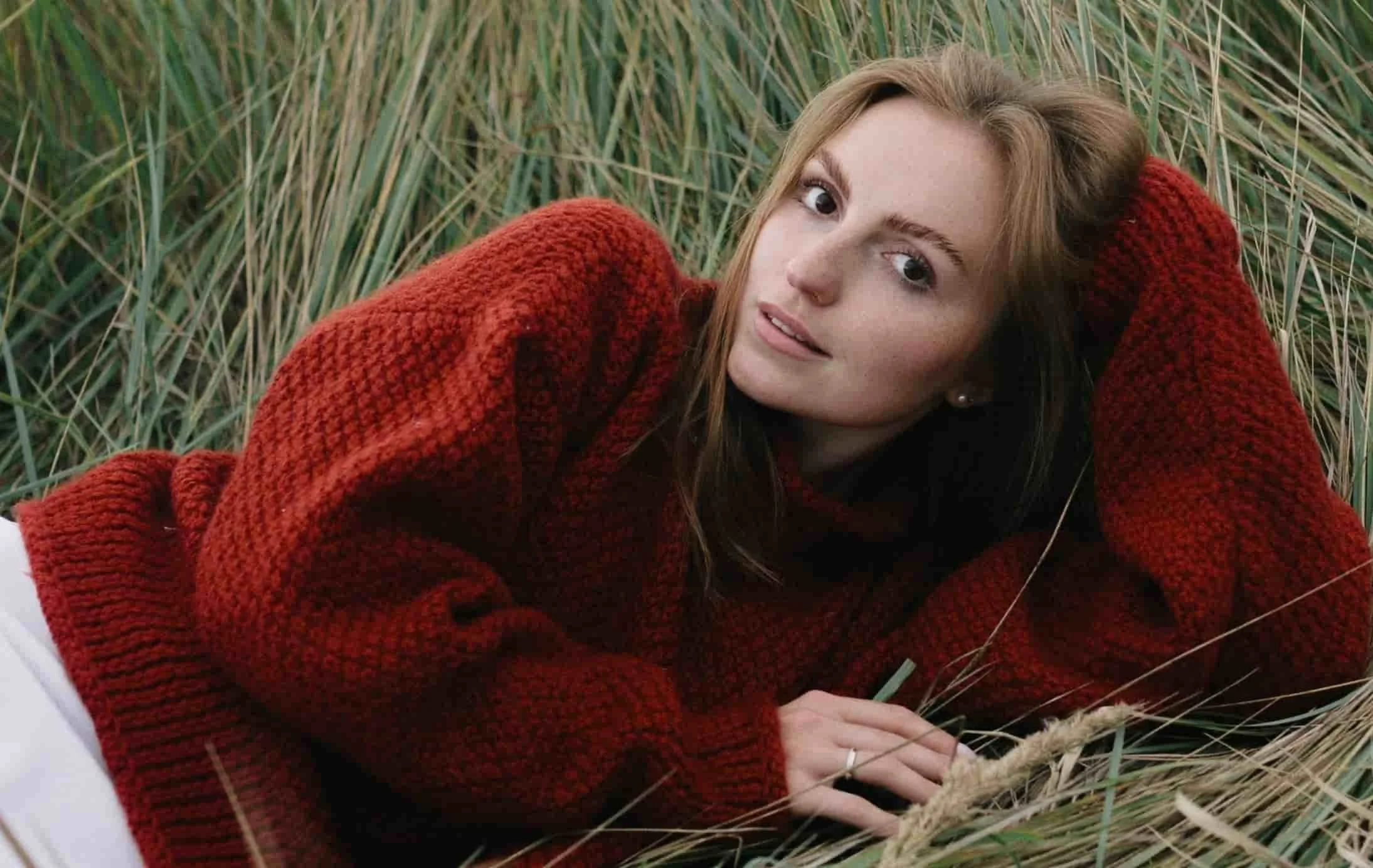 woman laying in grass