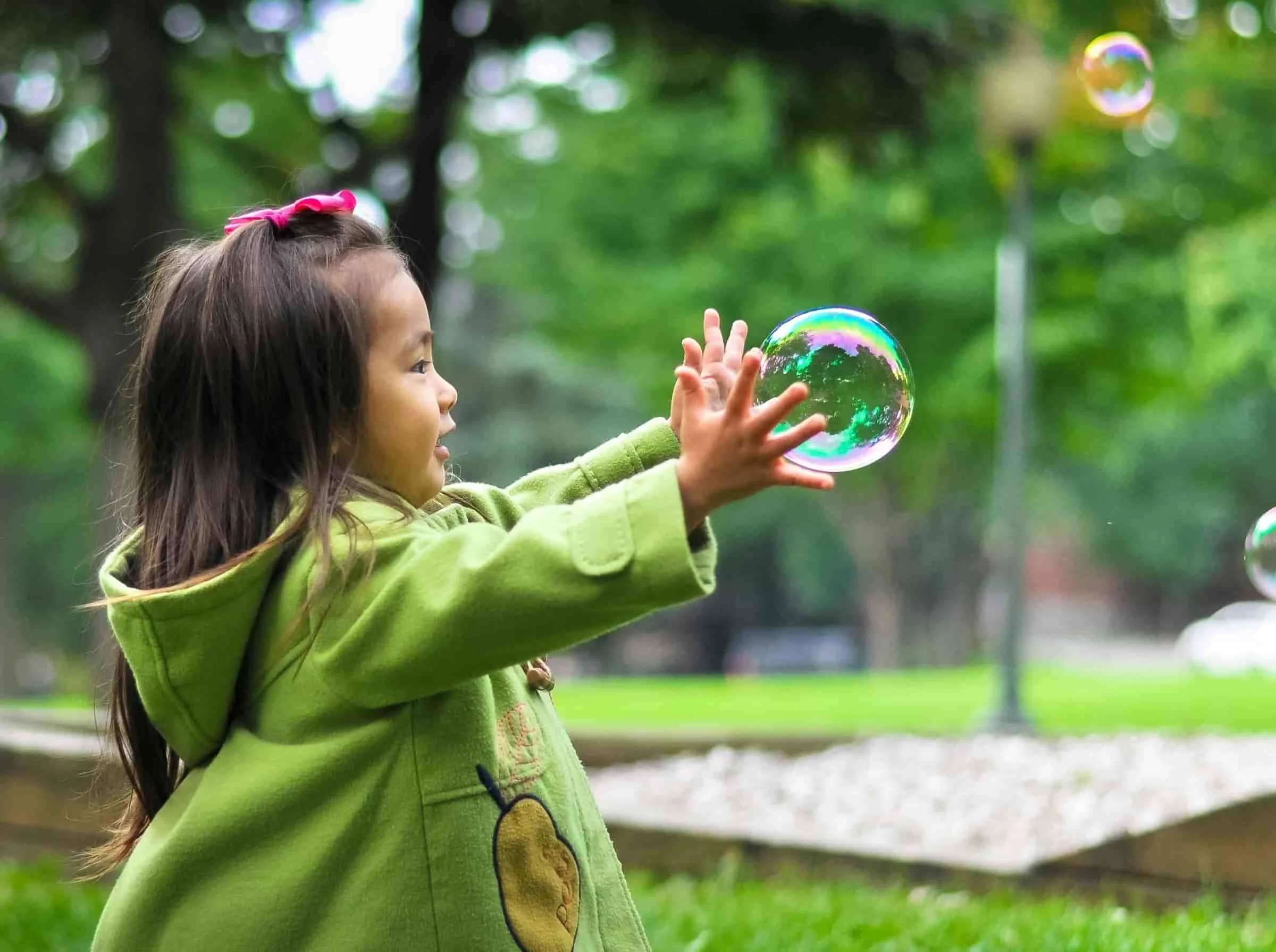 cbt anxiety depression child playing outside with bubbles
