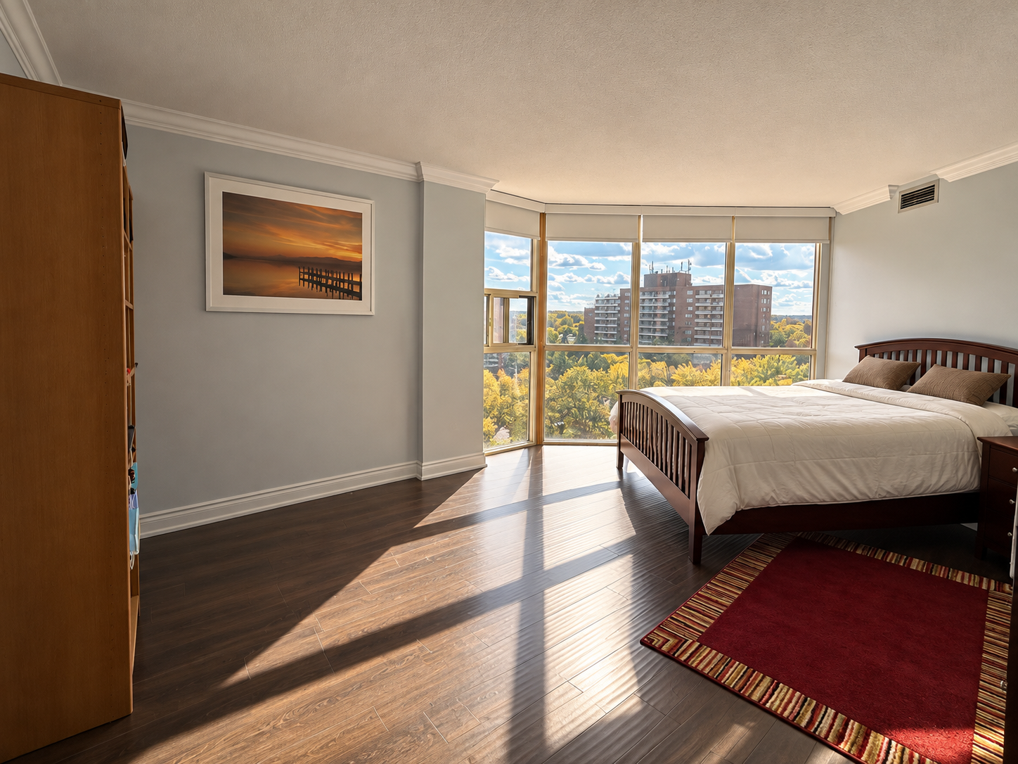 Sunlit Modern Bedroom with City Views.png
