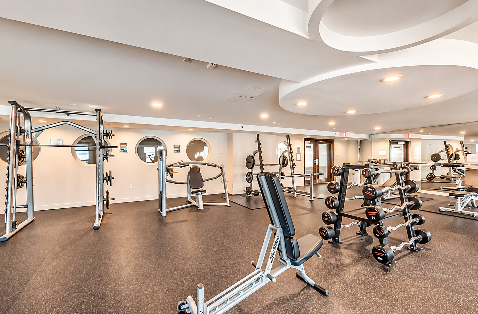 Modern Condo Gym with Strength Equipment.png