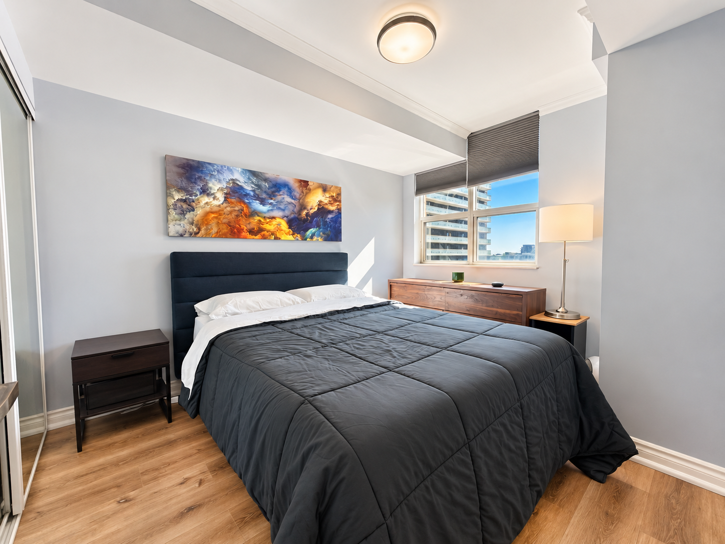 Modern Bedroom with Stormy Abstract Art.png