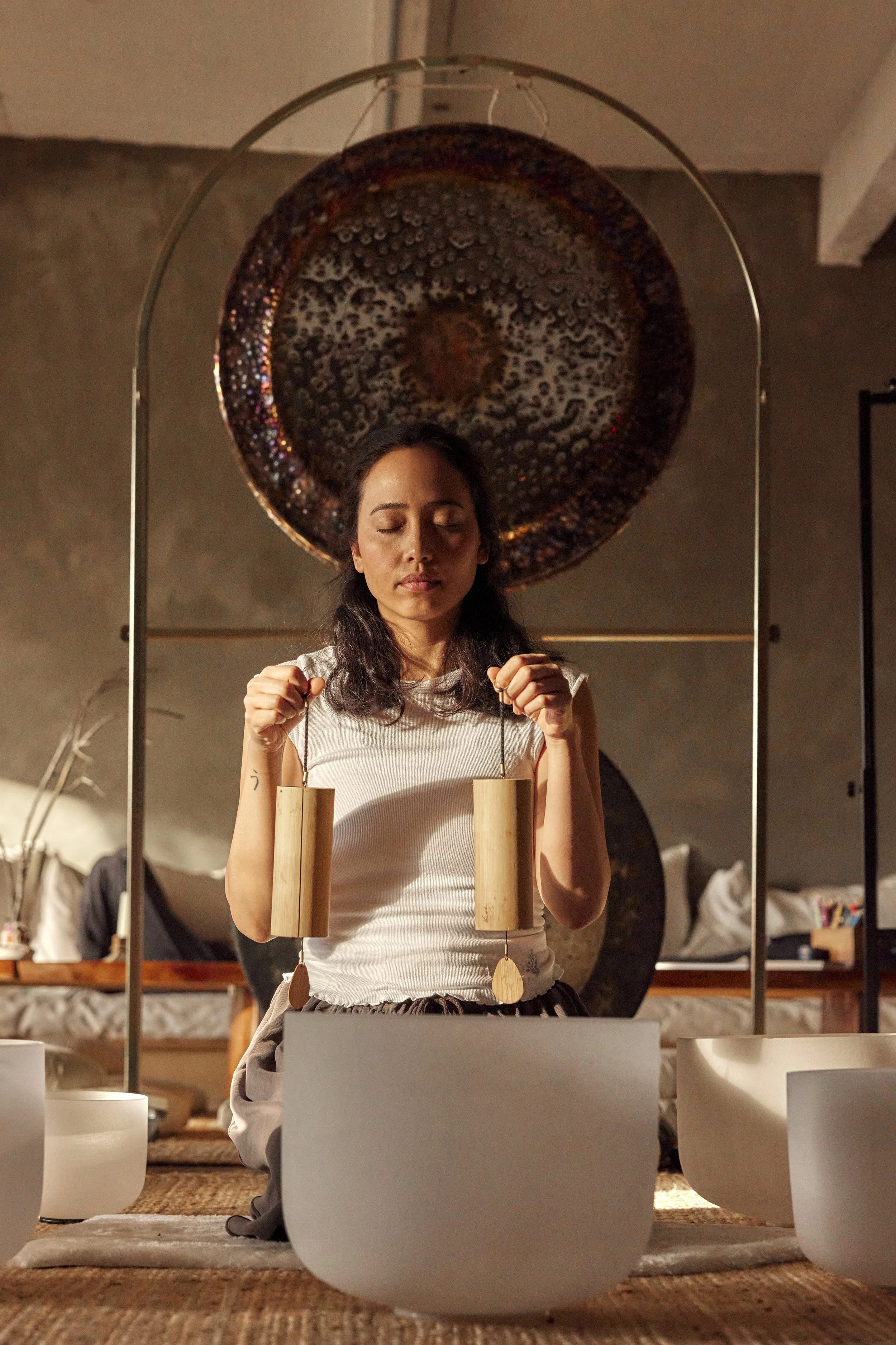 Sound bath session in Berwyn PA using koshi chimes and crystal singing bowls for nervous system regulation