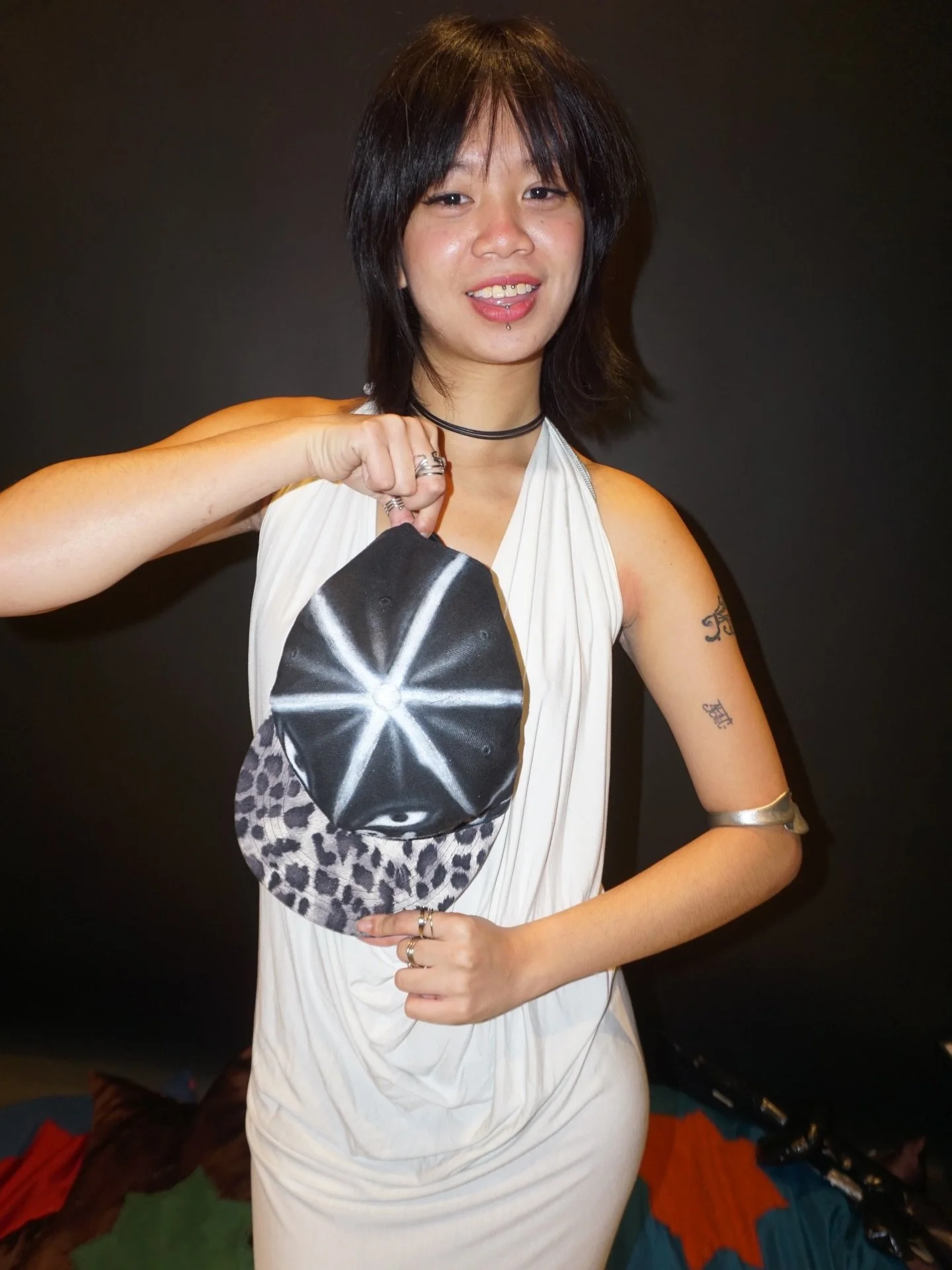 stunning @sophiaromulo in the cheetah snapback and white cowl neck dress 🪽