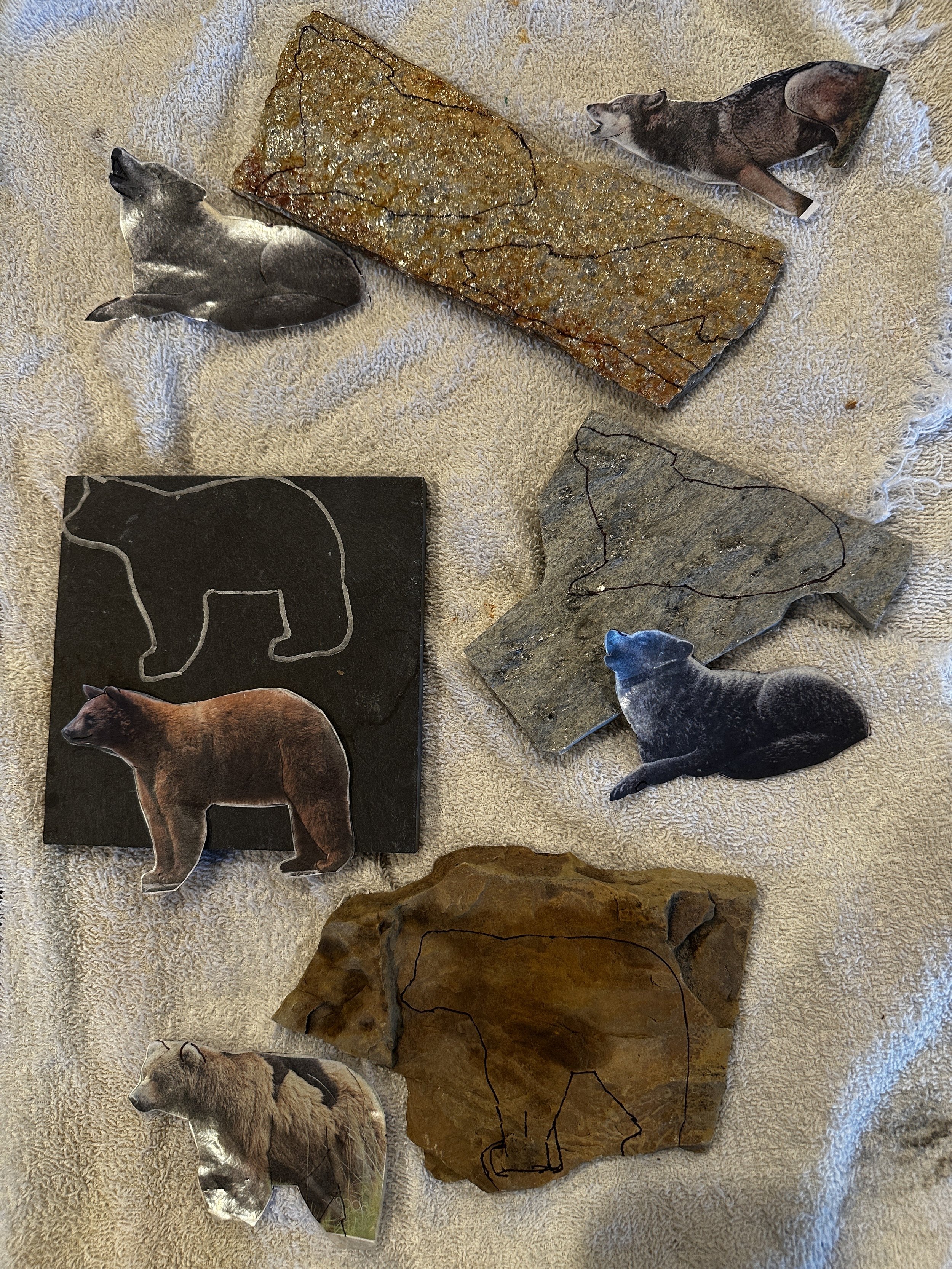 Wolves cut from stone, black bear cut from black limestone, grizzly cut from metamorphic rock. #bearart #blackbearartwork #grizzlybearart #wolfart #greywolf #stonemosaics #rizzocustomcreations