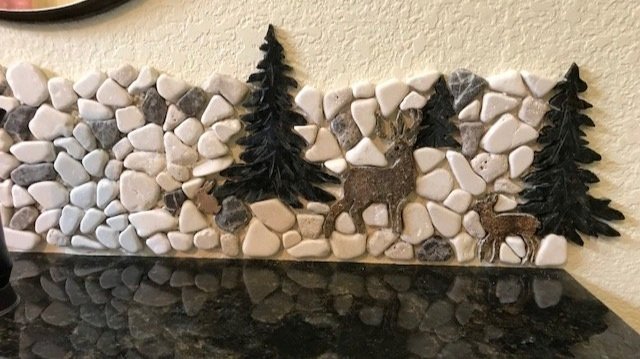 This sandstone deer couple and tiny bunny under the tree, warily watch the bear family from the safety of granite pine tree grove.