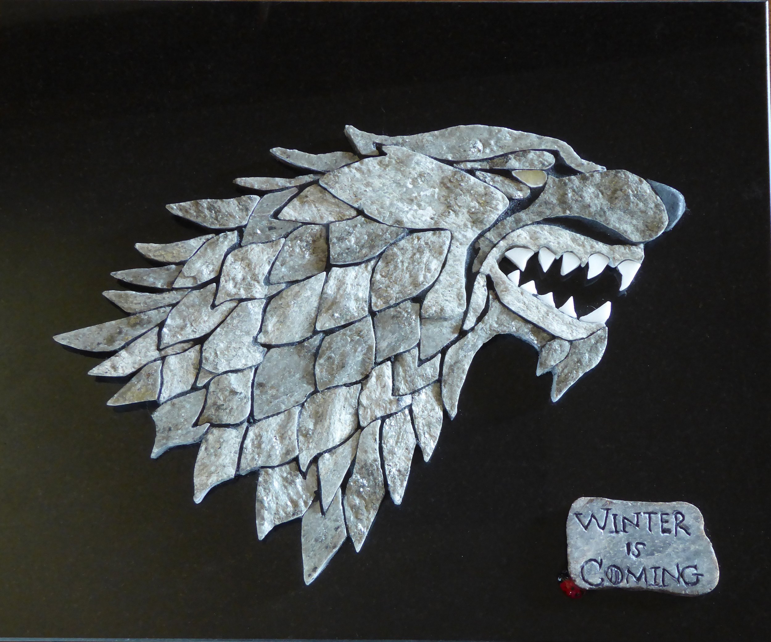 SOLD
GRANITE DIREWOLD
14.5" x 12"
For Game of Throne Fans, I made this magnificent direwolf. He is crafted from rare phyllite stone tile I scrounged from an old stone yard. The phyllite’s wavy, coarse cleavage liberally sprinkled with silver mica fl