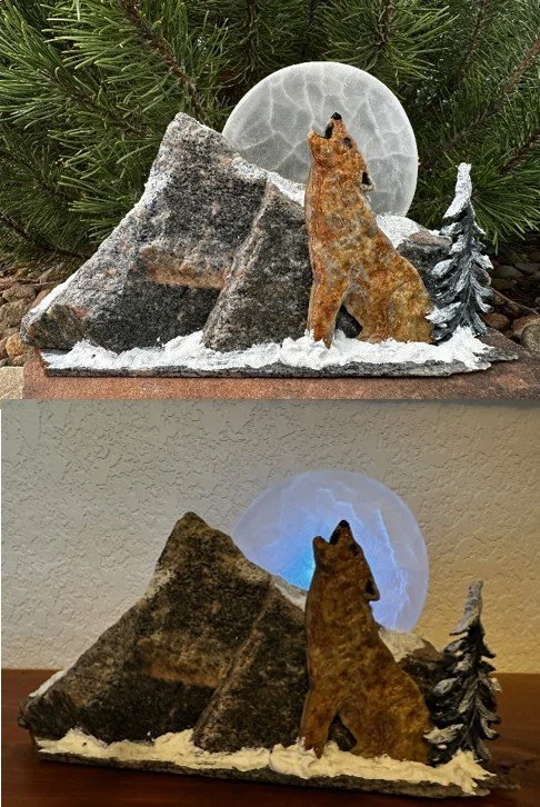 Stone mosaic wolf howling at selenite moon in front of stone mountain--lit with LED light