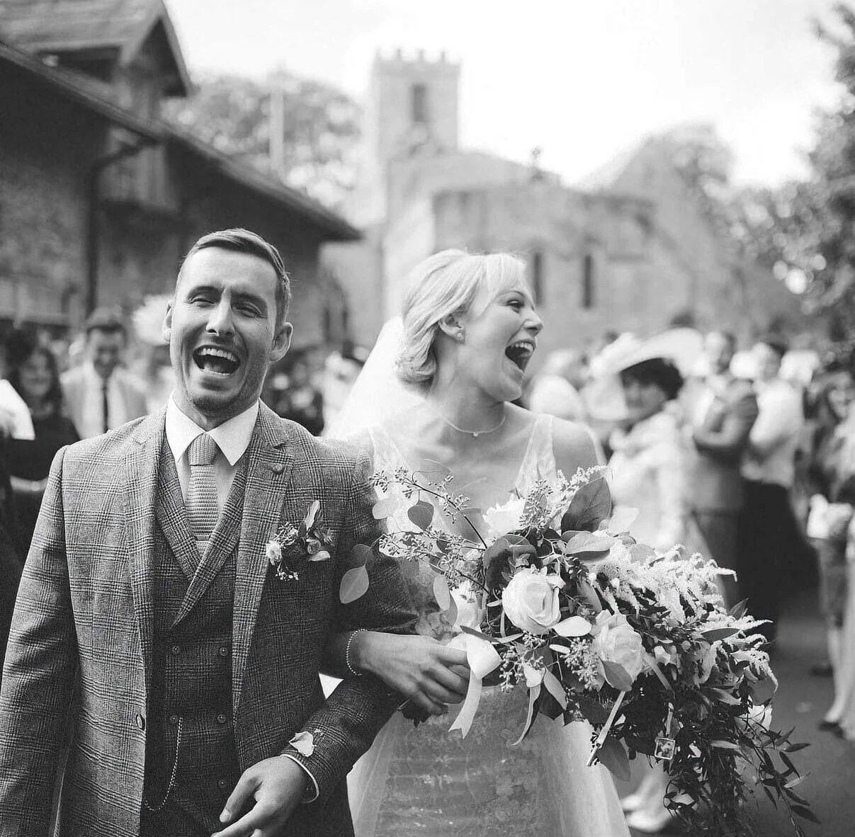 yorkshire wedding barn photographer bride and groom laughing and smiling