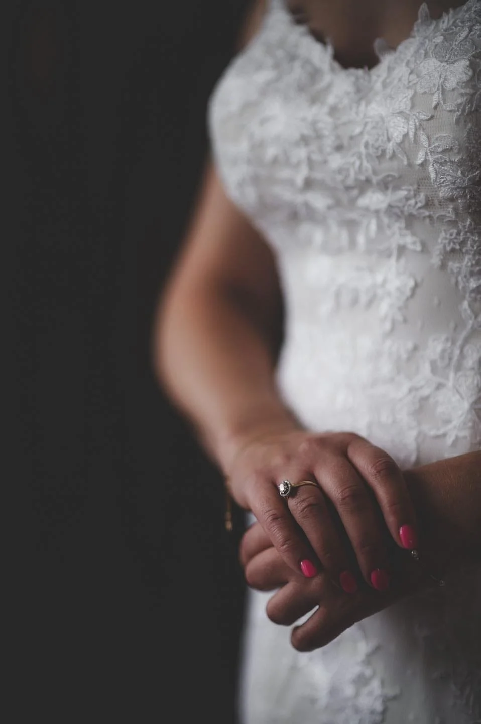 close uo photo of a bride's hands and her engagement ring at rossington hall