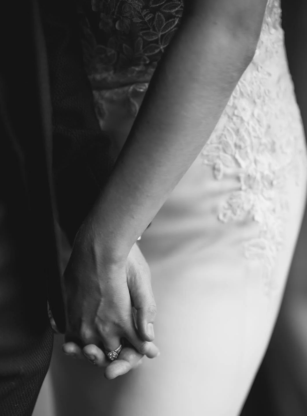 blackand white clsoe up of bride and groom holding hands at the-pumping-house-wedding-Photographer
