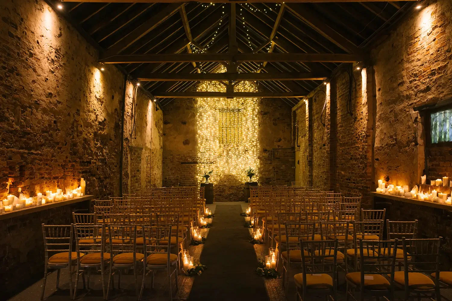 normans wedding barn ceremony by candleight and fairylight by yorkshire wedding photographer yorkshire portraitst