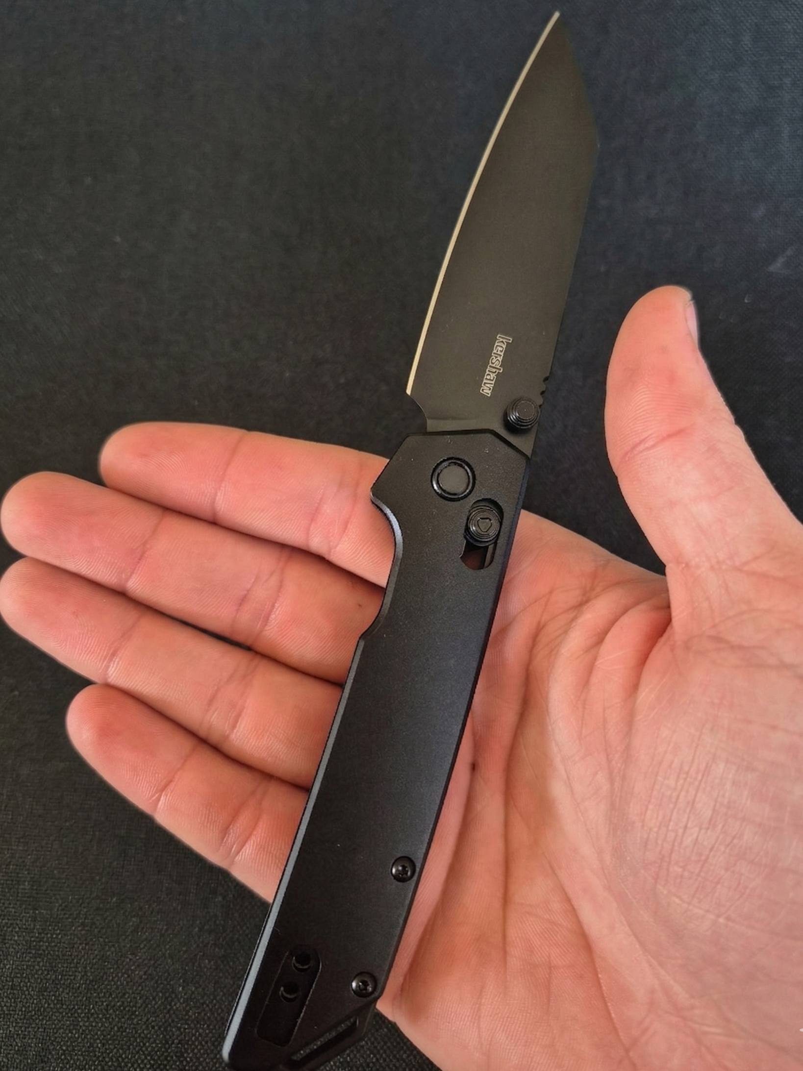 Kershaw folding knife open in hand showing frame lock mechanism