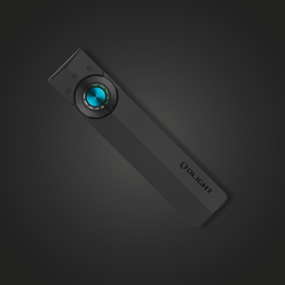 Olight ArkPro flashlight in black, top view showing the rotary dial
