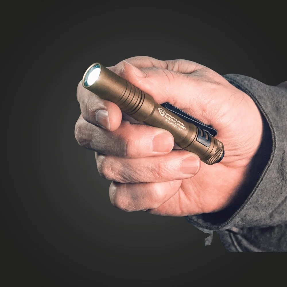 Streamlight MicroStream USB coyote flashlight held in hand