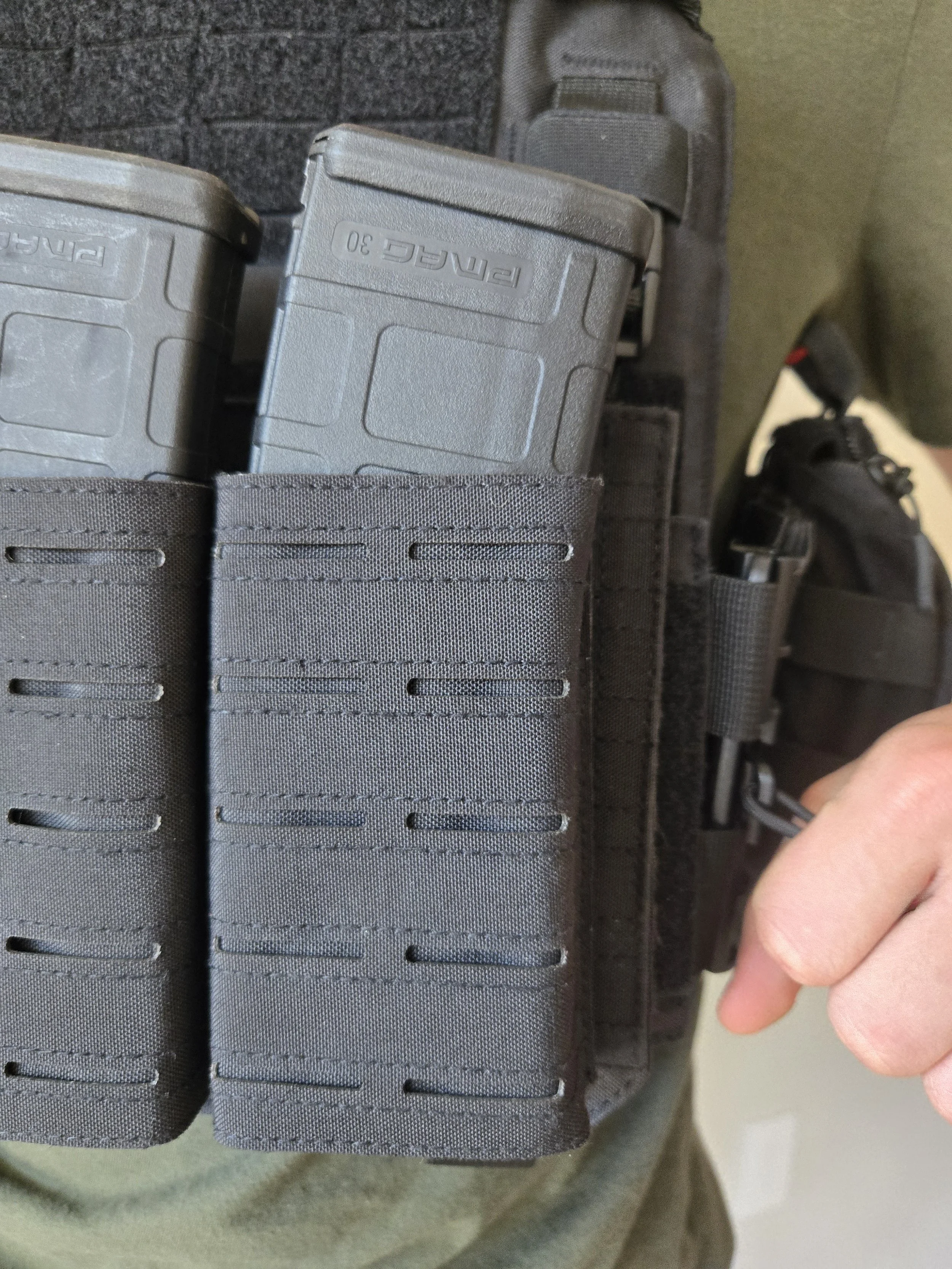 Detail of side quick-release buckle on tactical vest