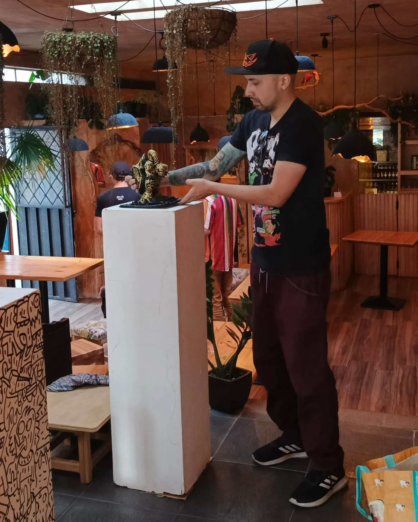 Professional art toy maker setting up a custom designer toy for exhibition. I create lowbrow action figures and diy platforms for global gallery displays.
