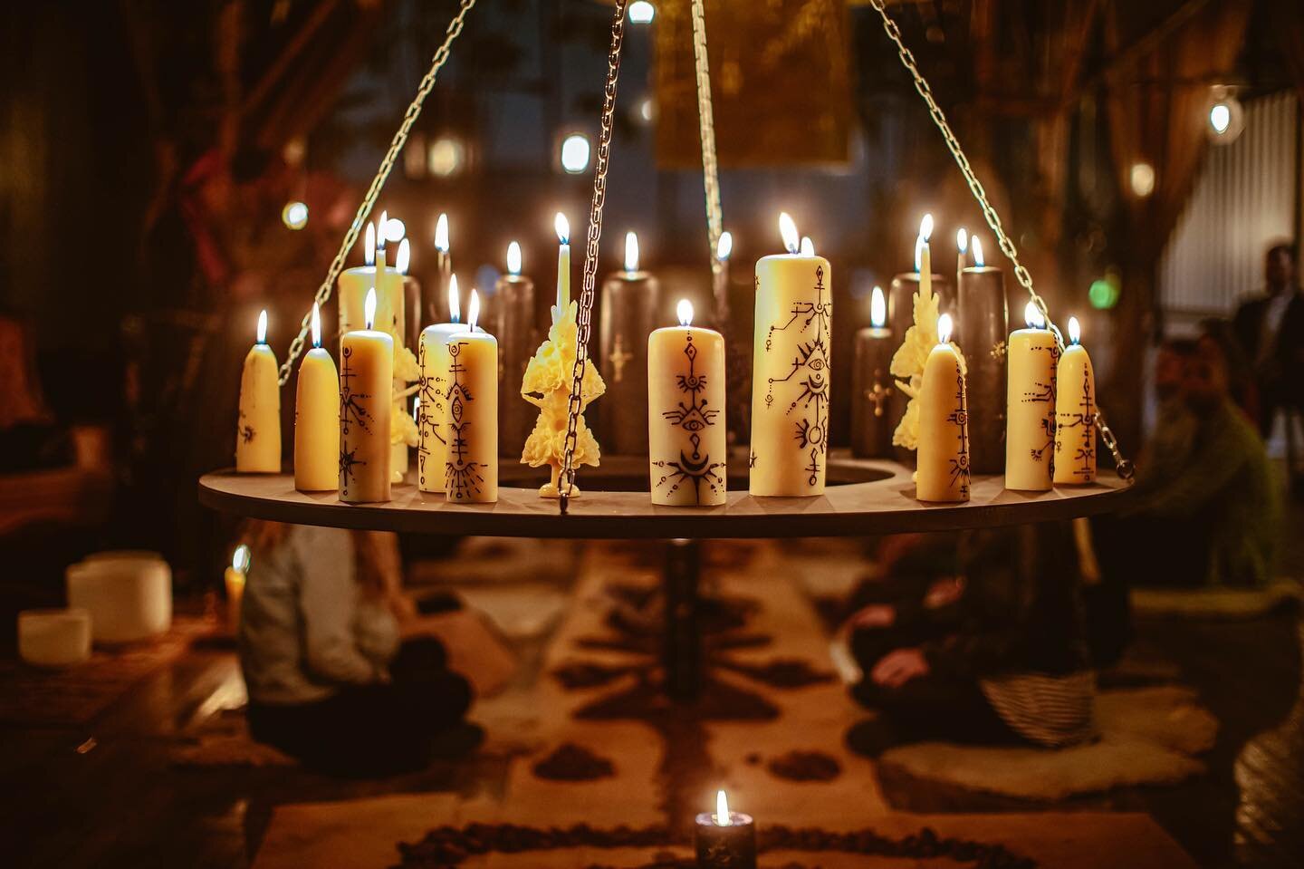 Through these rituals we are reminded of our stellar origins and connection to Earth&rsquo;s elements.
Suspended circular altar with black and white candles as a symbol of our duality existence and how we should balance shadow and light to be in harm