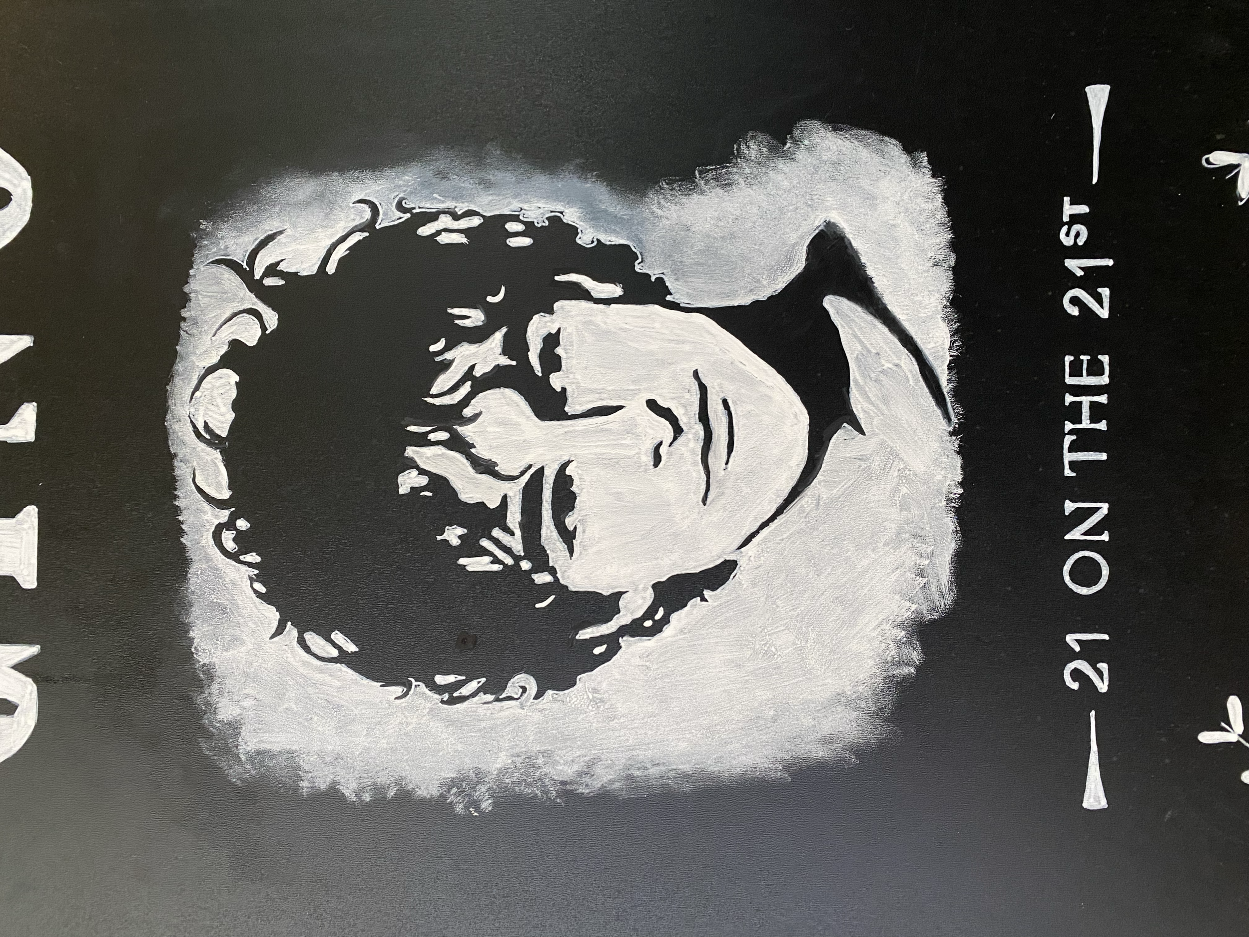 Close up image of a hand illustrated chalkboard portrait, below it are hand lettered words "21 on the 21st"